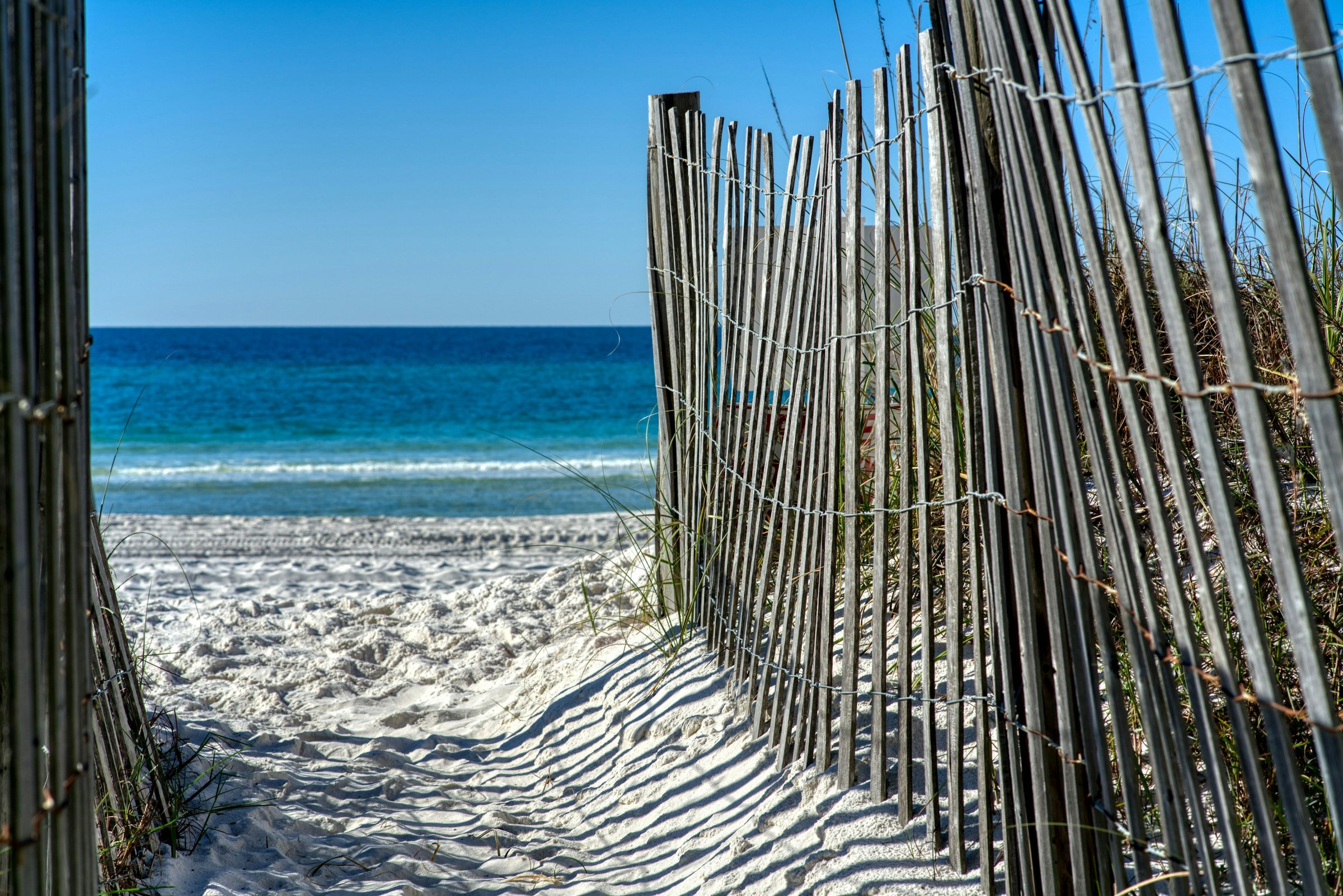 Private beach access path through the dunes at Bid-A-Wee Beach, the quiet west end of Panama City Beach, Florida