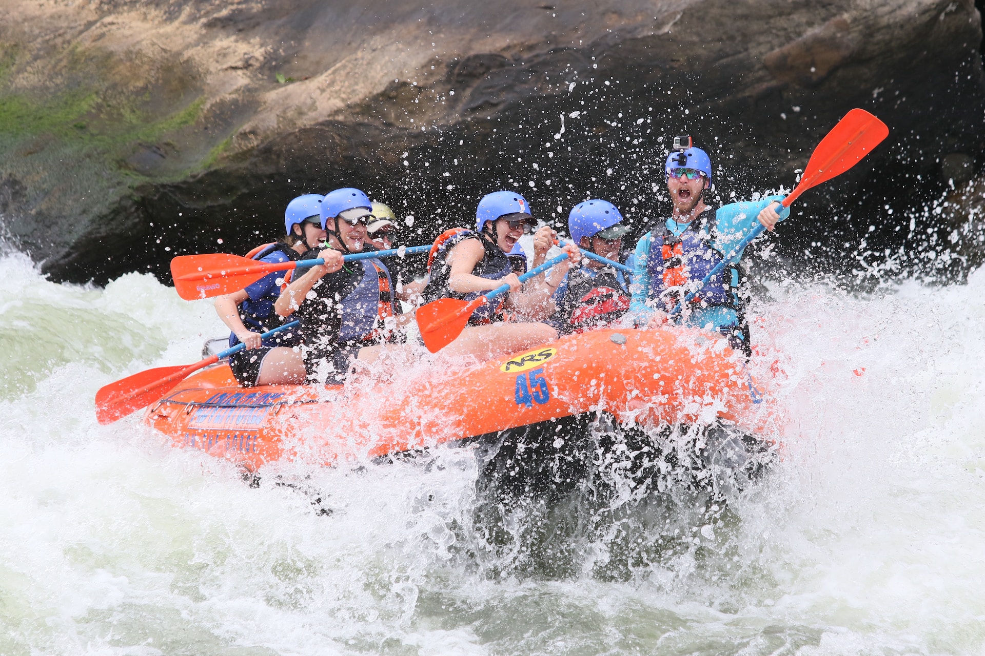 group of people whitewater rafting