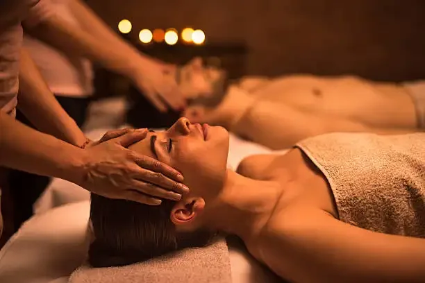 Licensed therapists offering couples massage in suite at Arrowhead Manor
