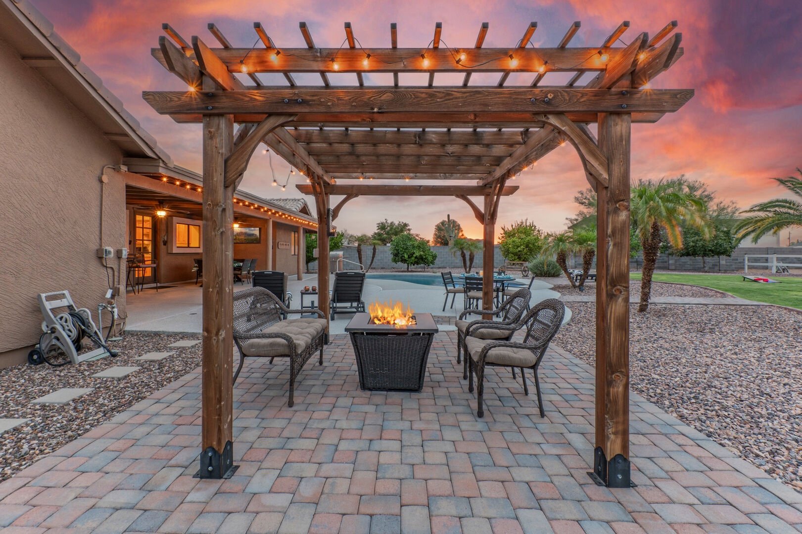 Pergola with fire pit and pool at an Arizona vacation rental