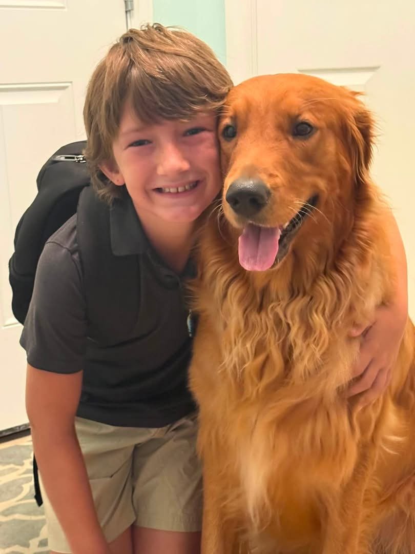 Boy with golden retriever
