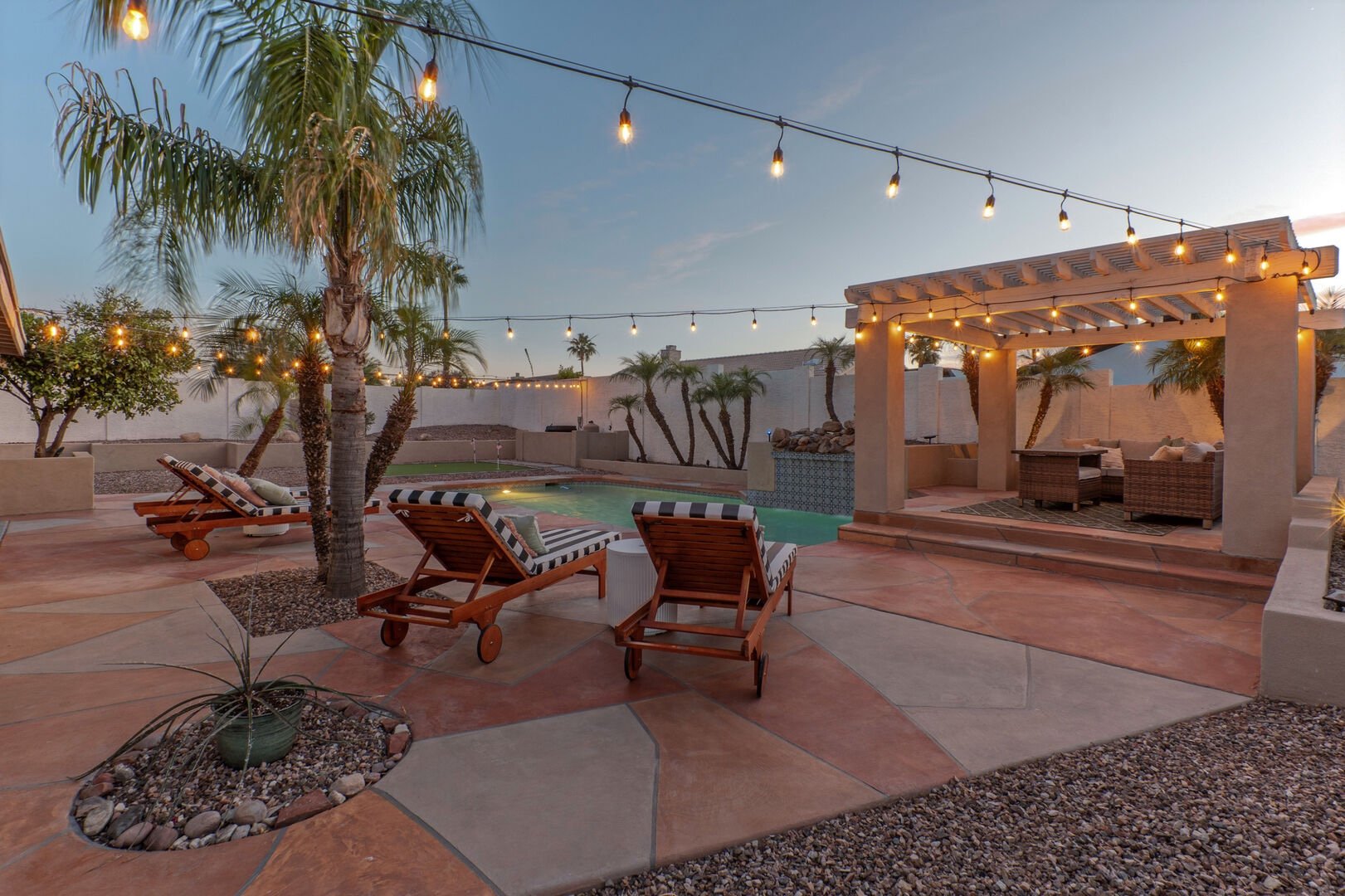 Arizona vacation rental backyard with pool and string lights