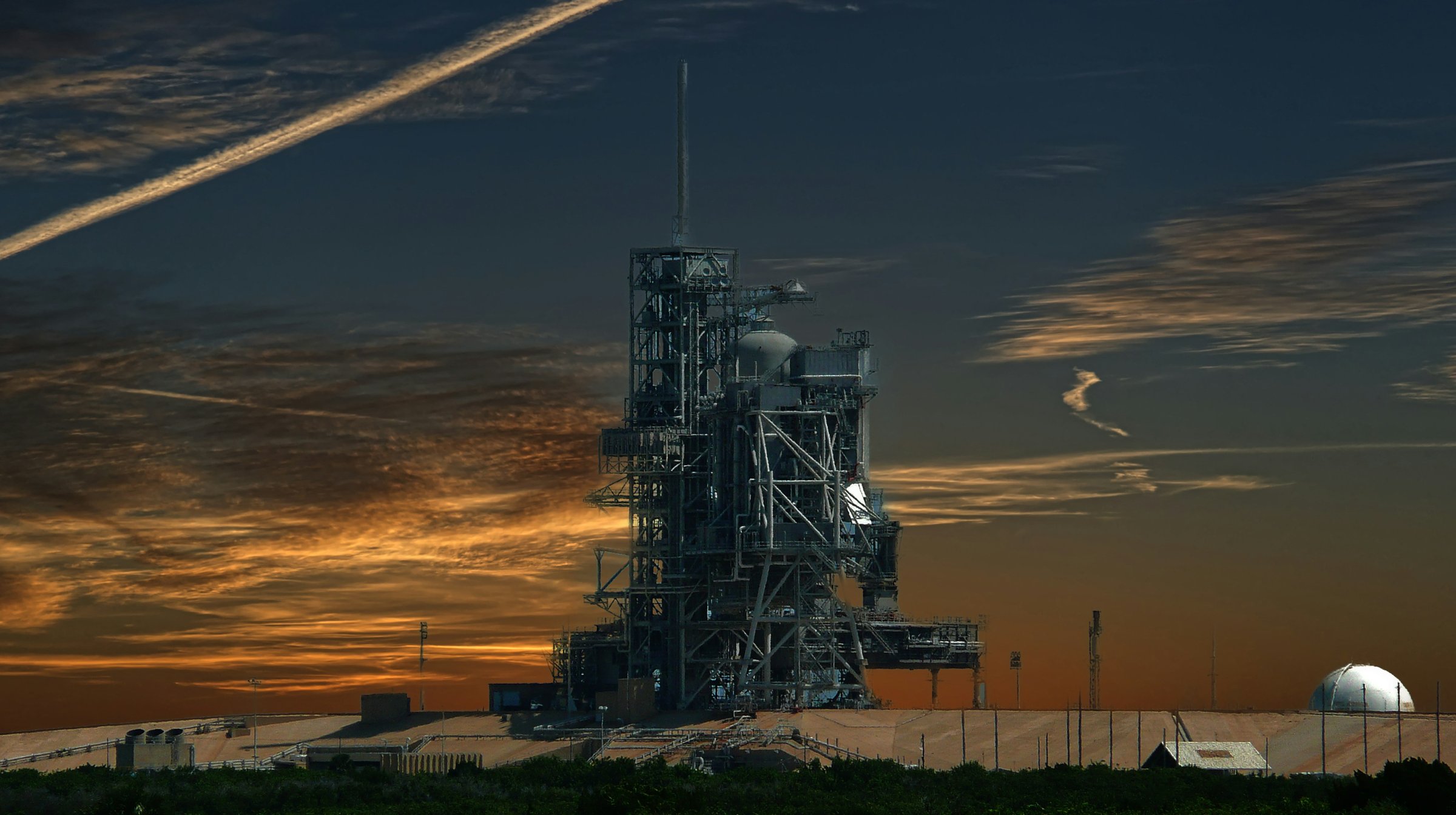 Evening view of the beach and Atlantic shoreline at Cape Canaveral, Florida, looking north toward the launch pads