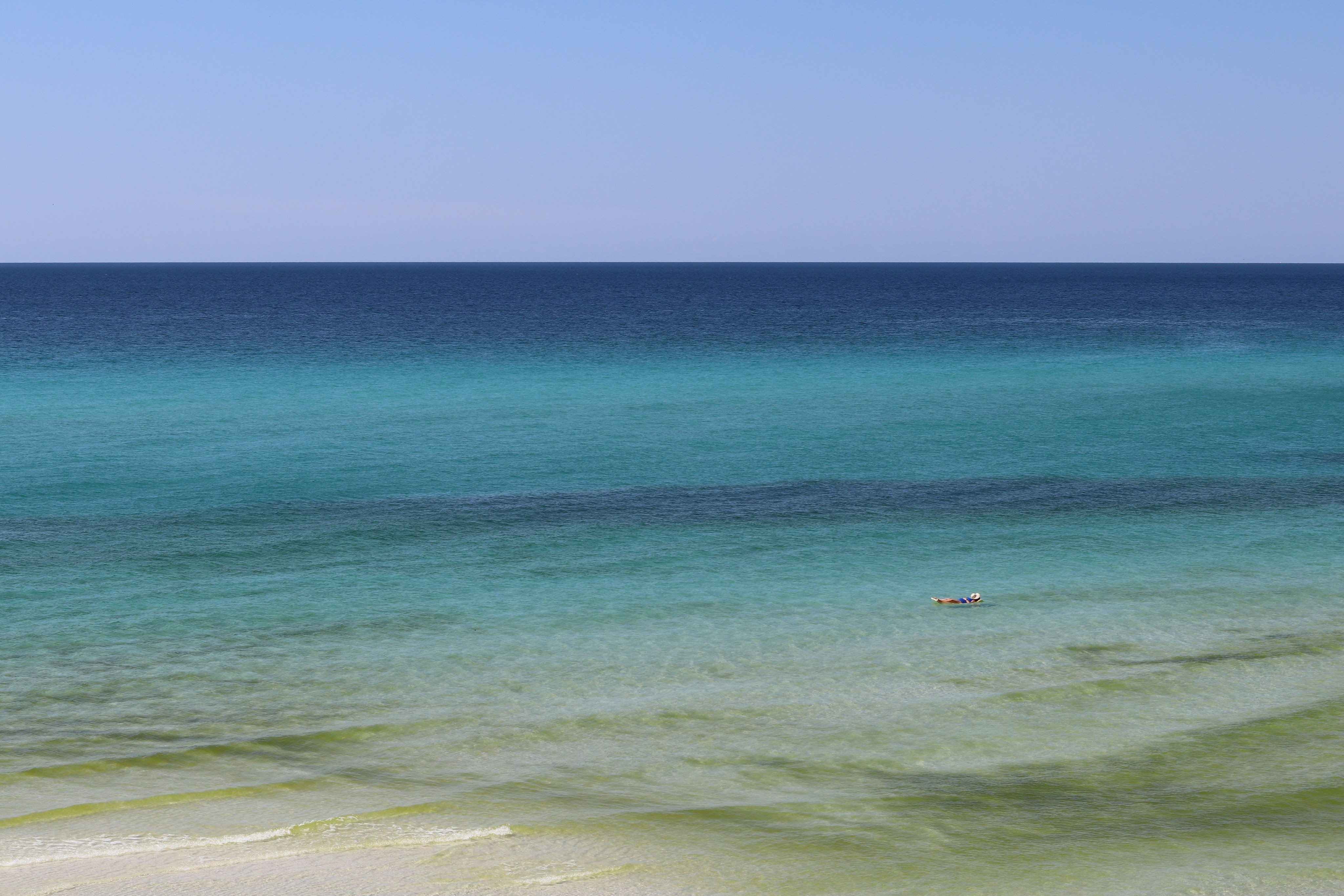 Clear turquoise Gulf water with white sand at Bradenton Beach, Florida