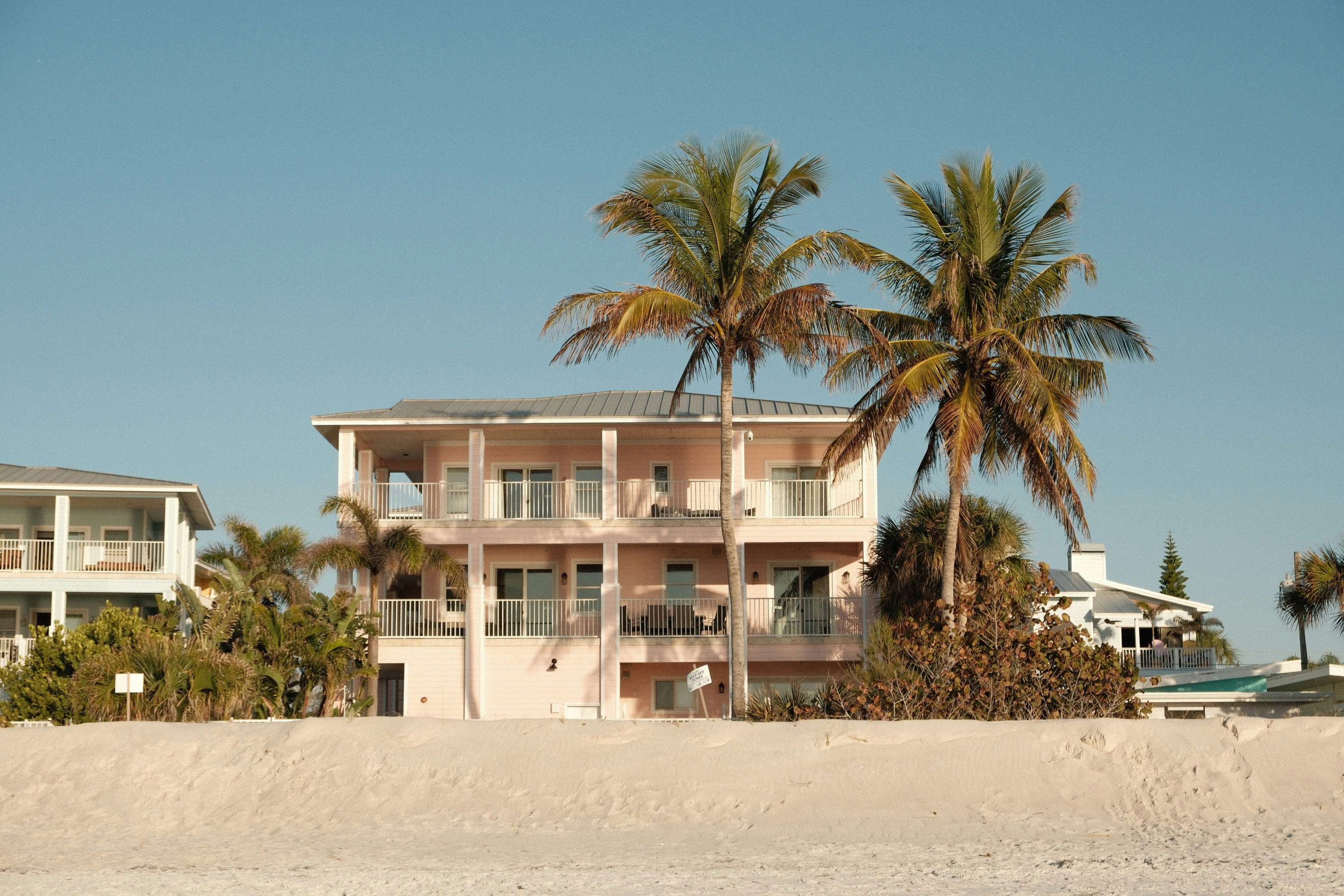 Holmes Beach Florida beachfront home with palm trees