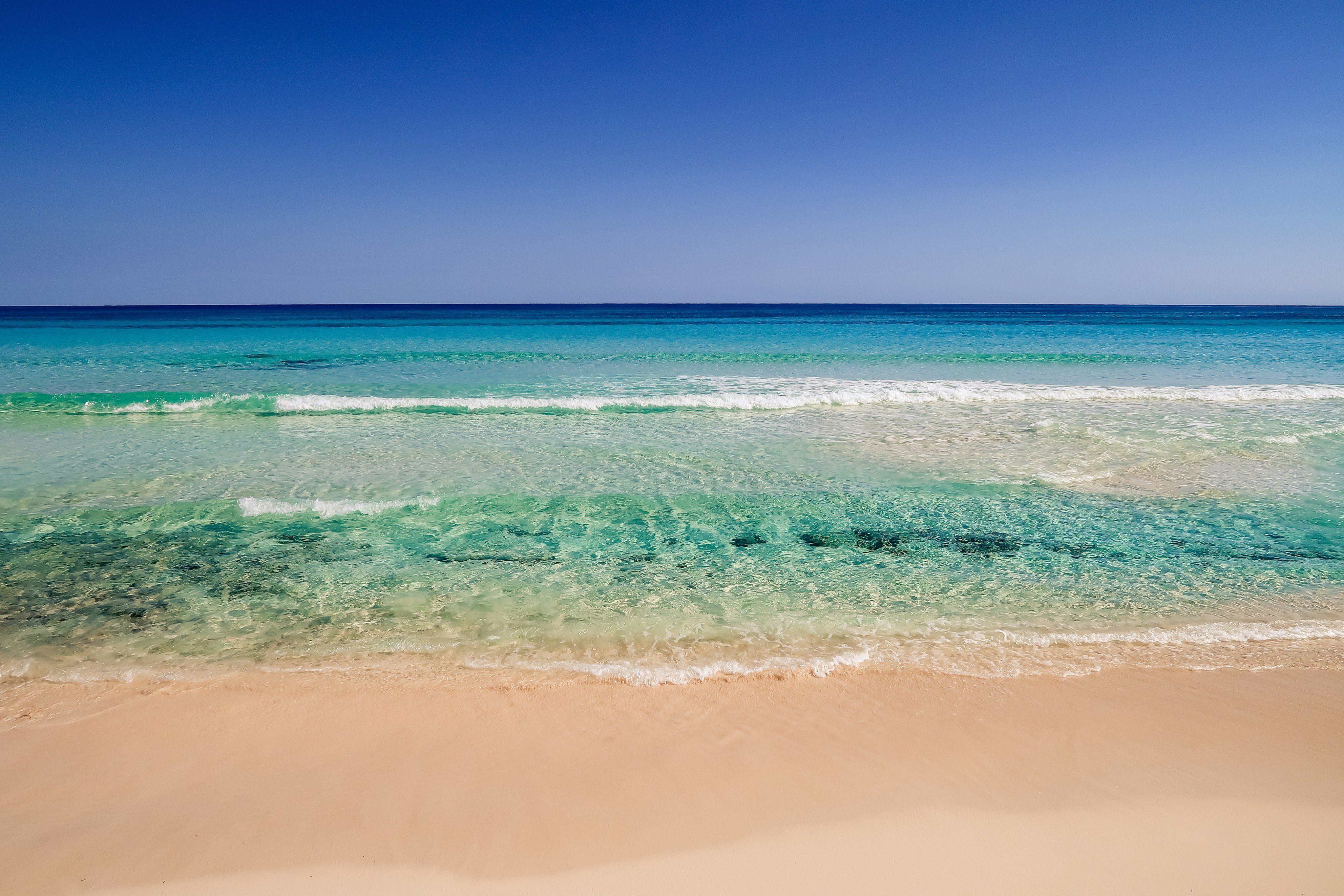 White sand beach with turquoise water, Holmes Beach, Florida