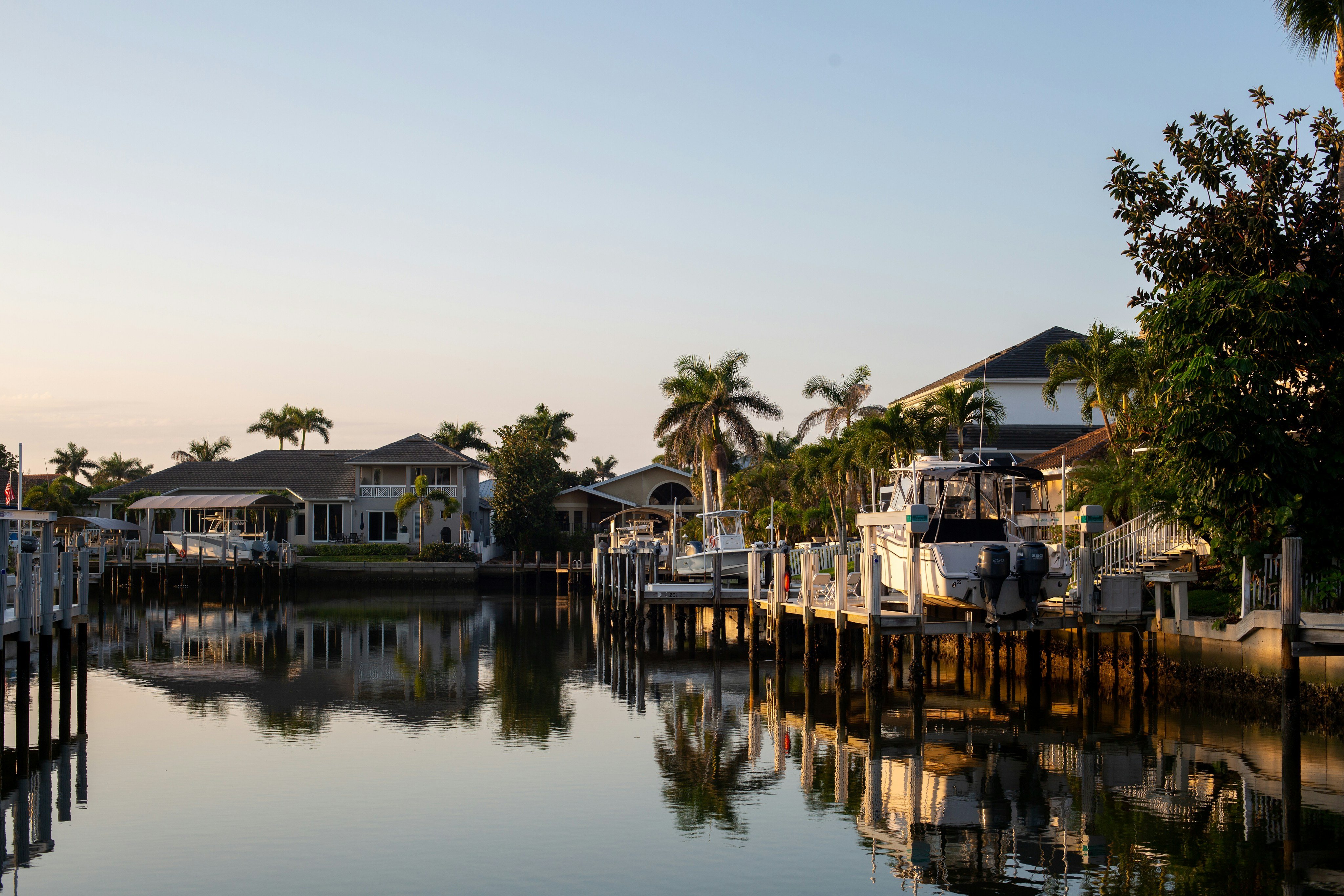 Florida waterfront homes with docks and boats on a calm canal, Largo area