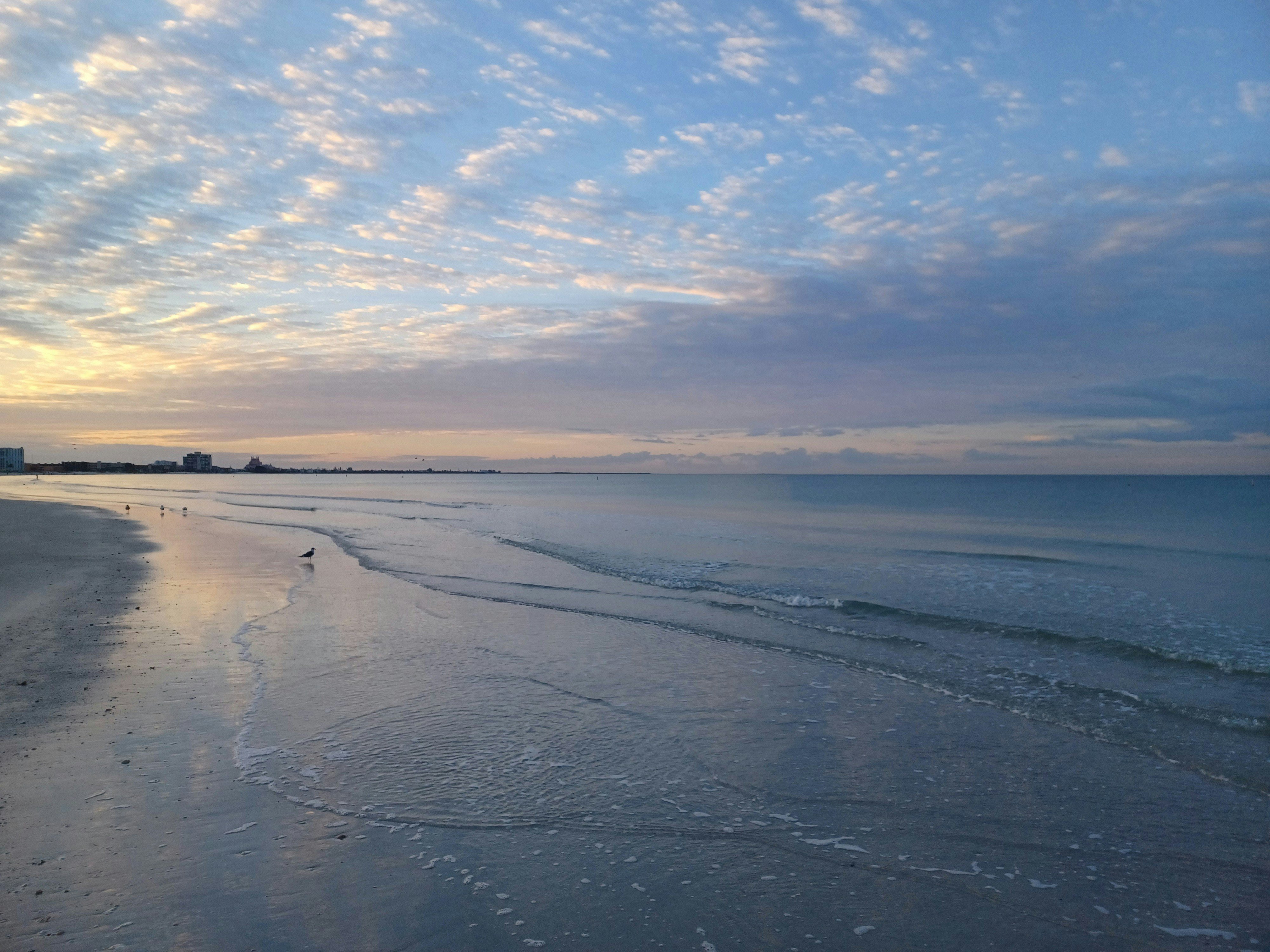 Bellair Beach Florida gulf coast sunrise with pastel sky and calm water
