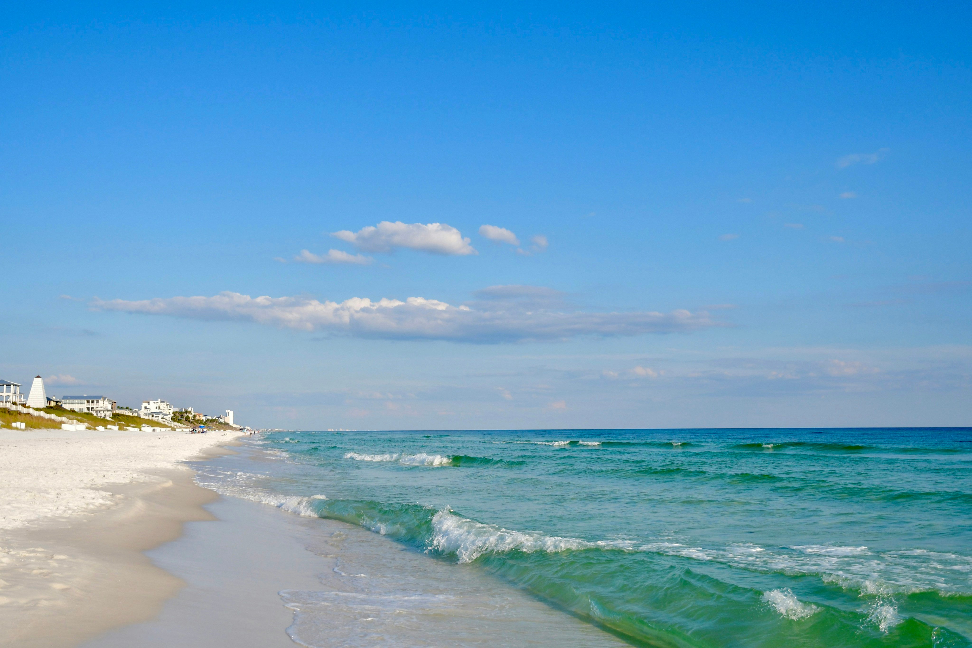 White sand beach with turquoise water and beach homes, Holmes Beach, Florida