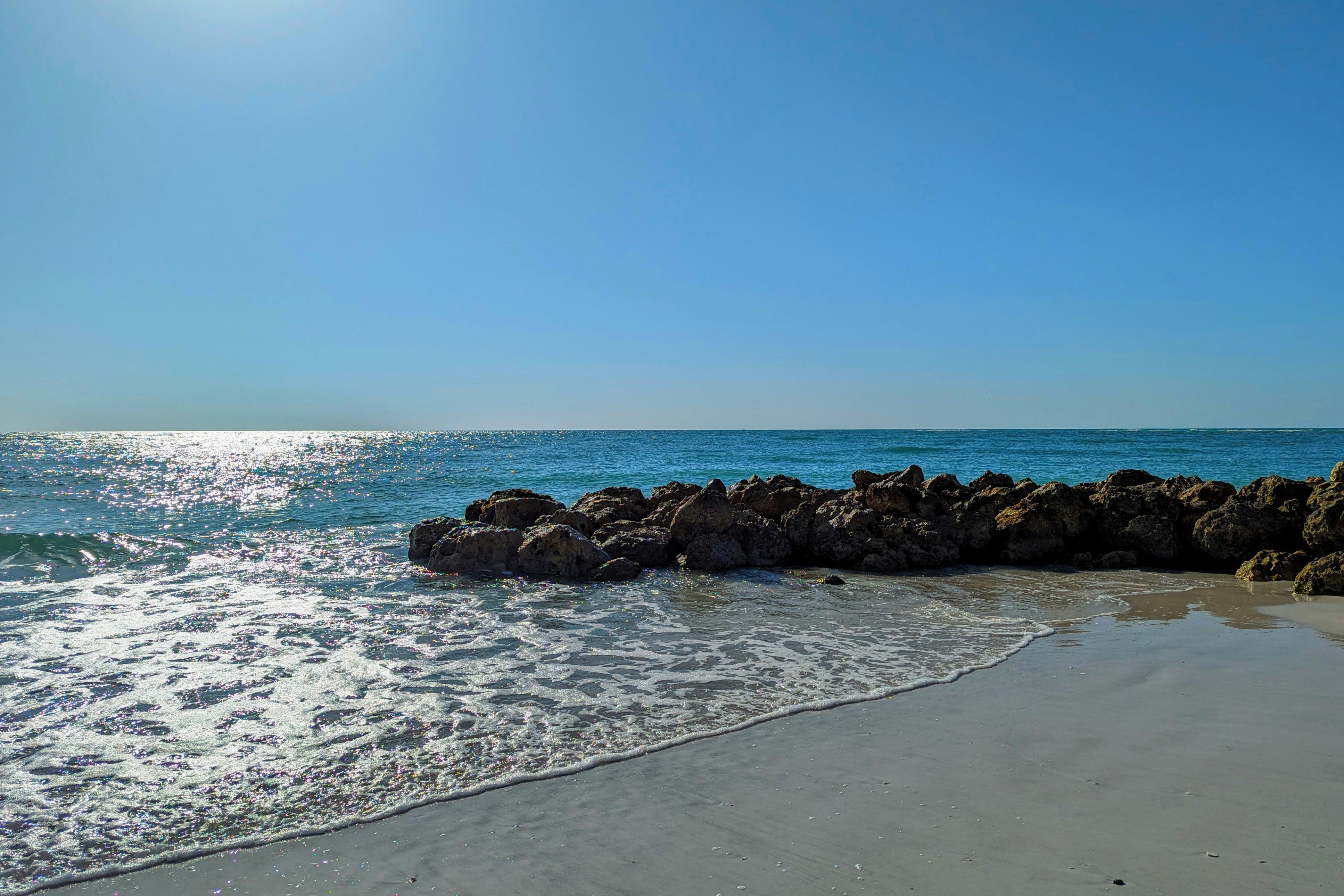 Sunny day at Indian Rocks Beach, Florida with blue sky and turquoise water