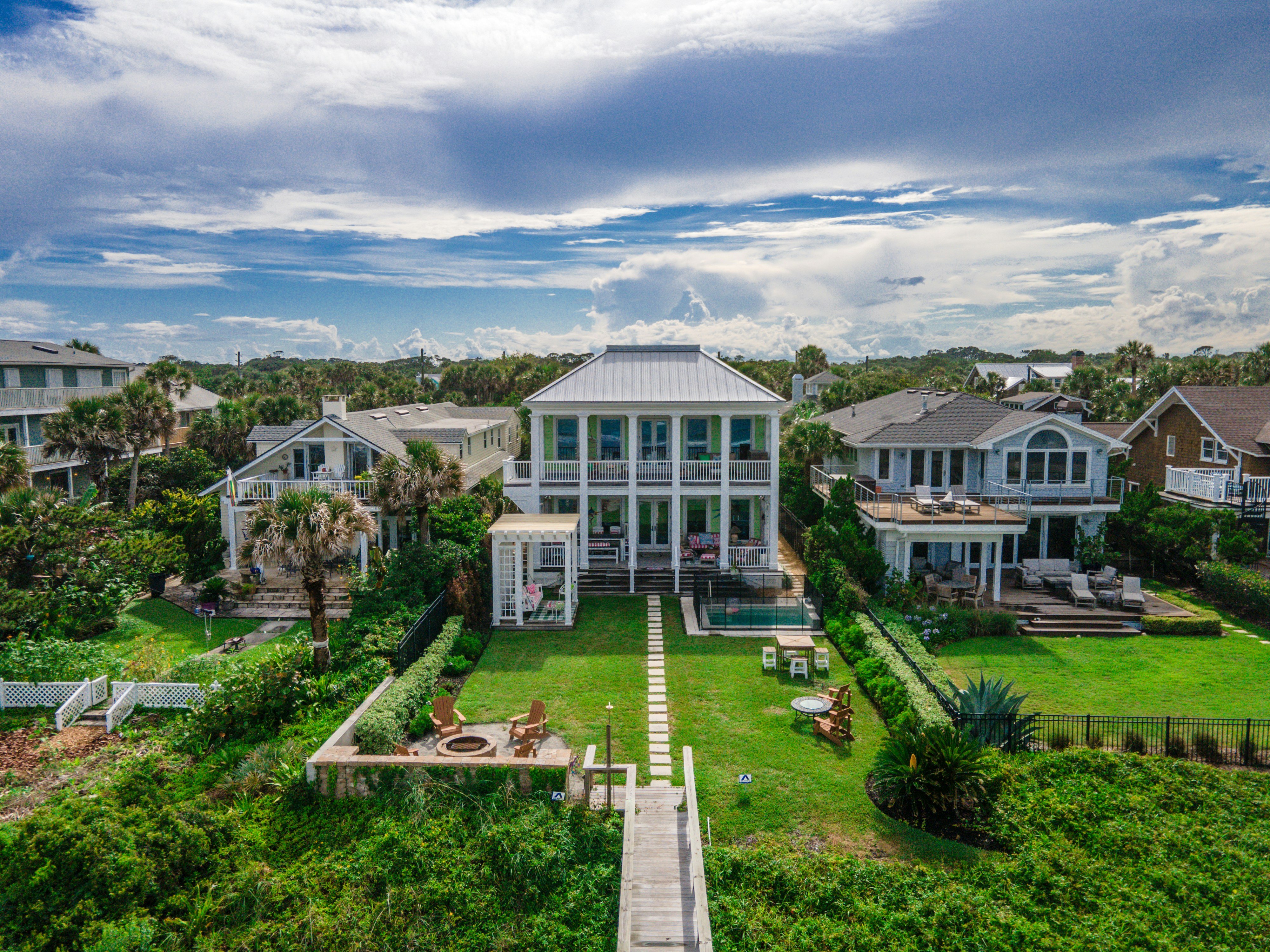 Luxury beachfront home with pool and palm trees, Holmes Beach, Florida