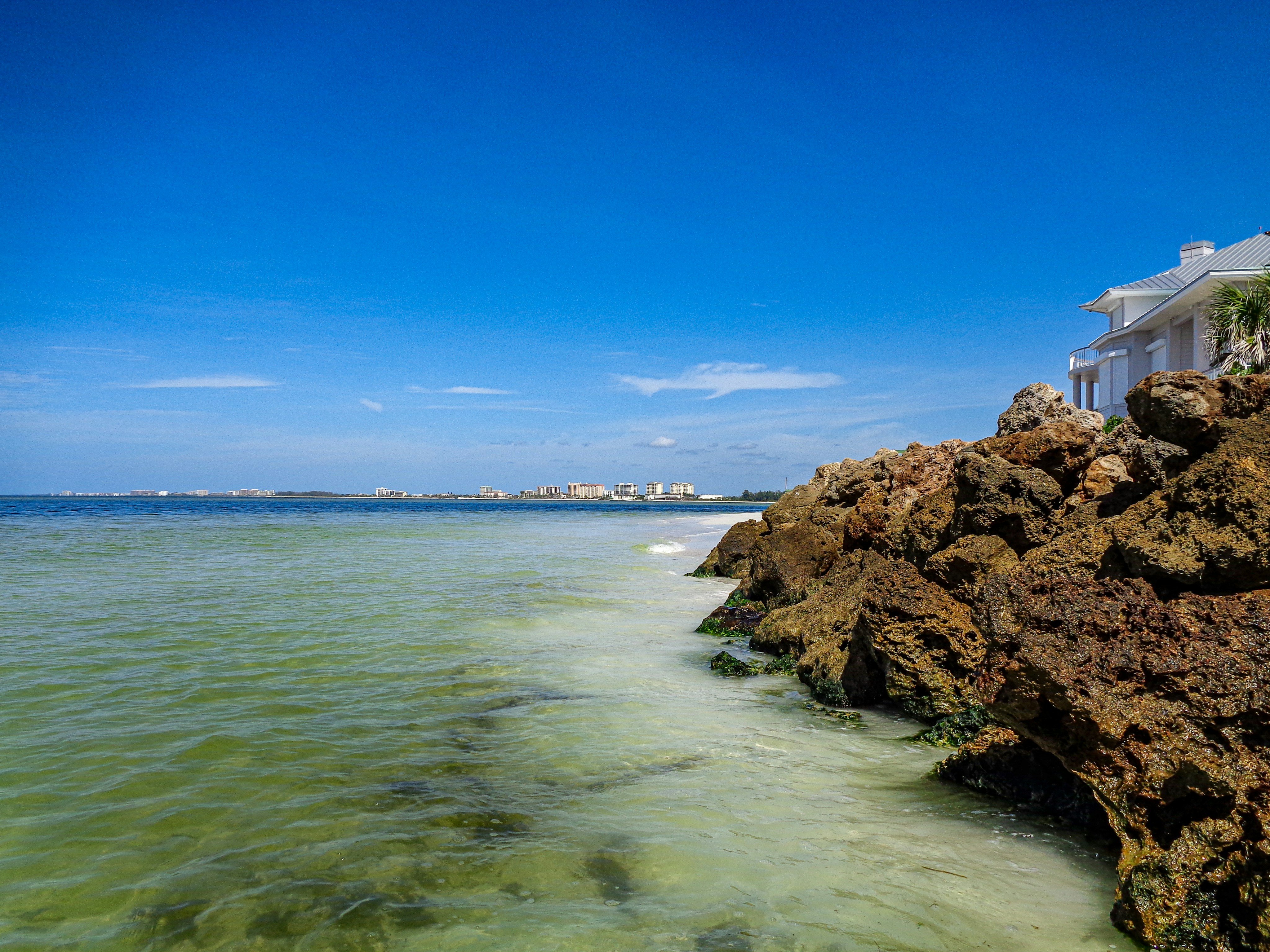 Siesta Key Florida coastal view with calm Gulf water and blue sky near Bradenton