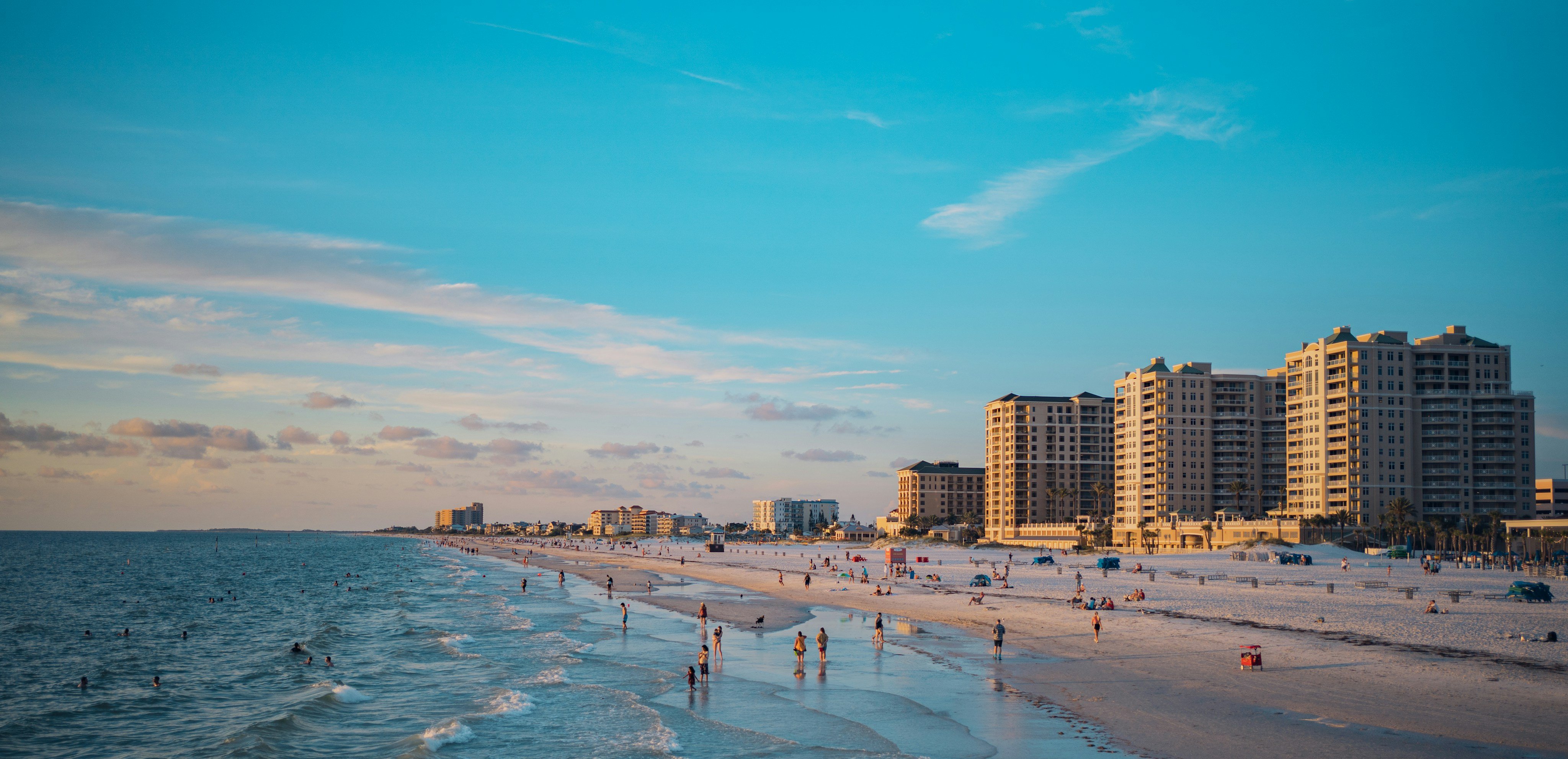 Clearwater Beach Florida shoreline with high-rise buildings at golden hour