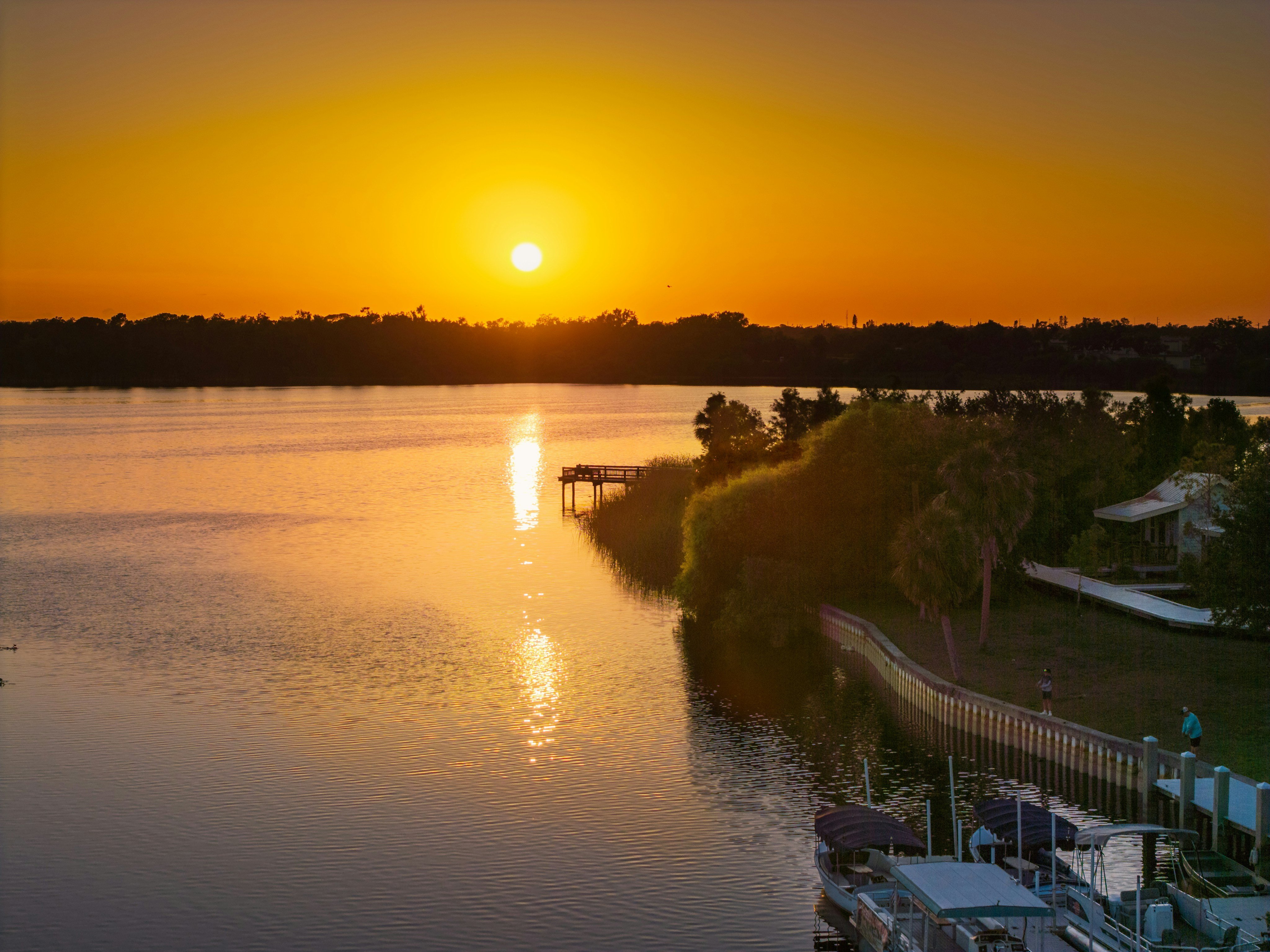 Golden sunset over Jiggs Landing dock in Bradenton, Florida