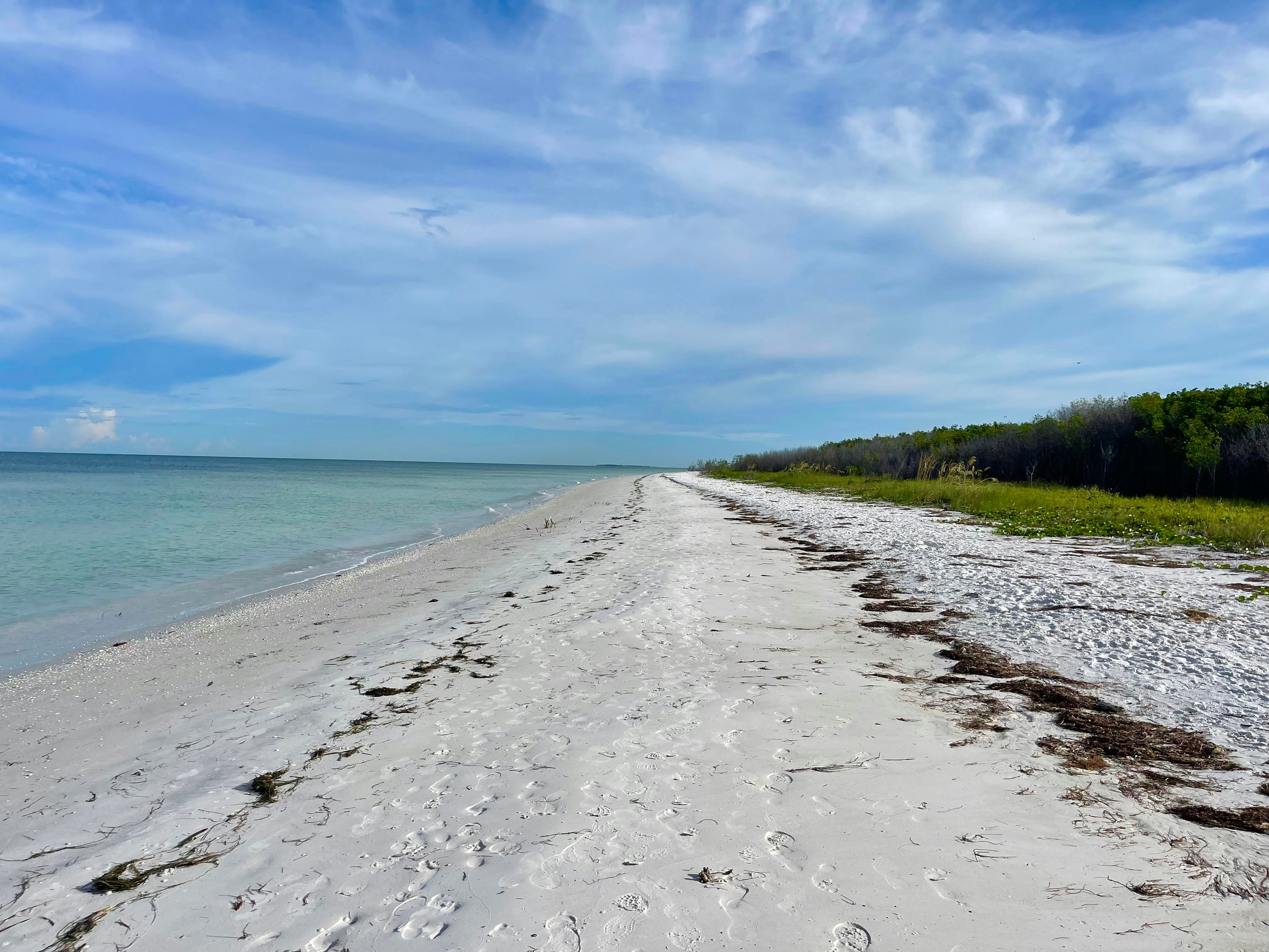 White sand beach with turquoise Gulf water near Bradenton Beach, Florida