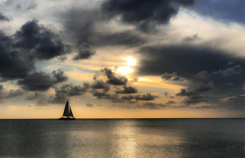 Large catamaran sailboat out at sea which is a great activity for newlyweds on their honeymoon on Grand Cayman