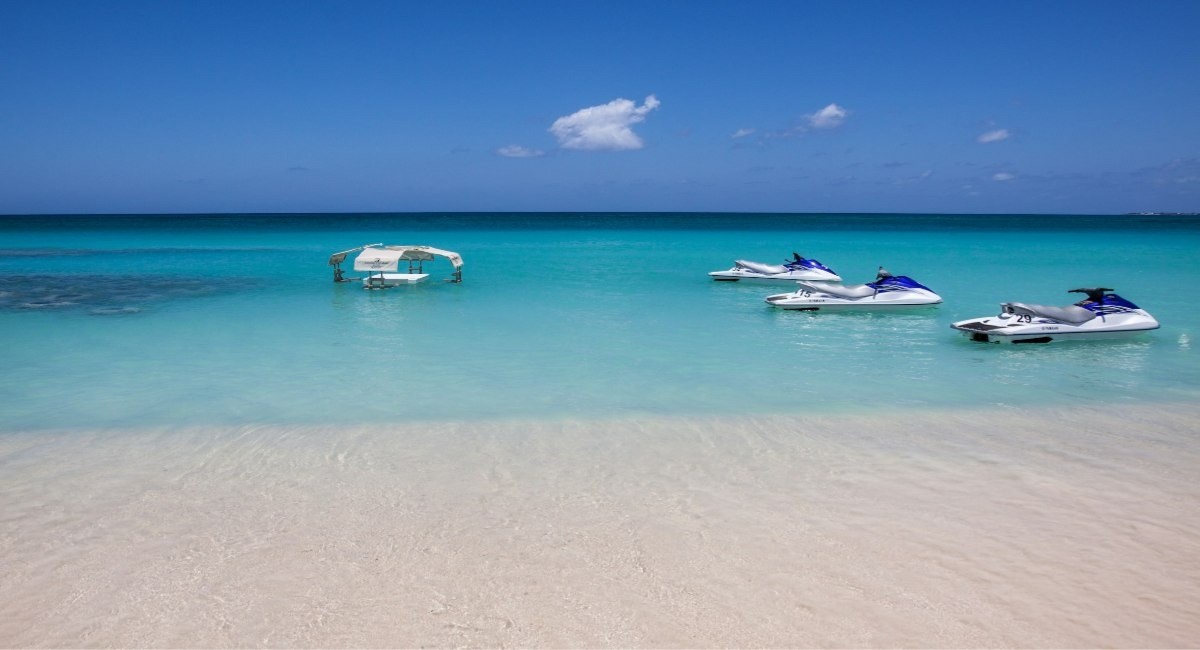 Jet skis on the turquoise water at George Town beach, Grand Cayman