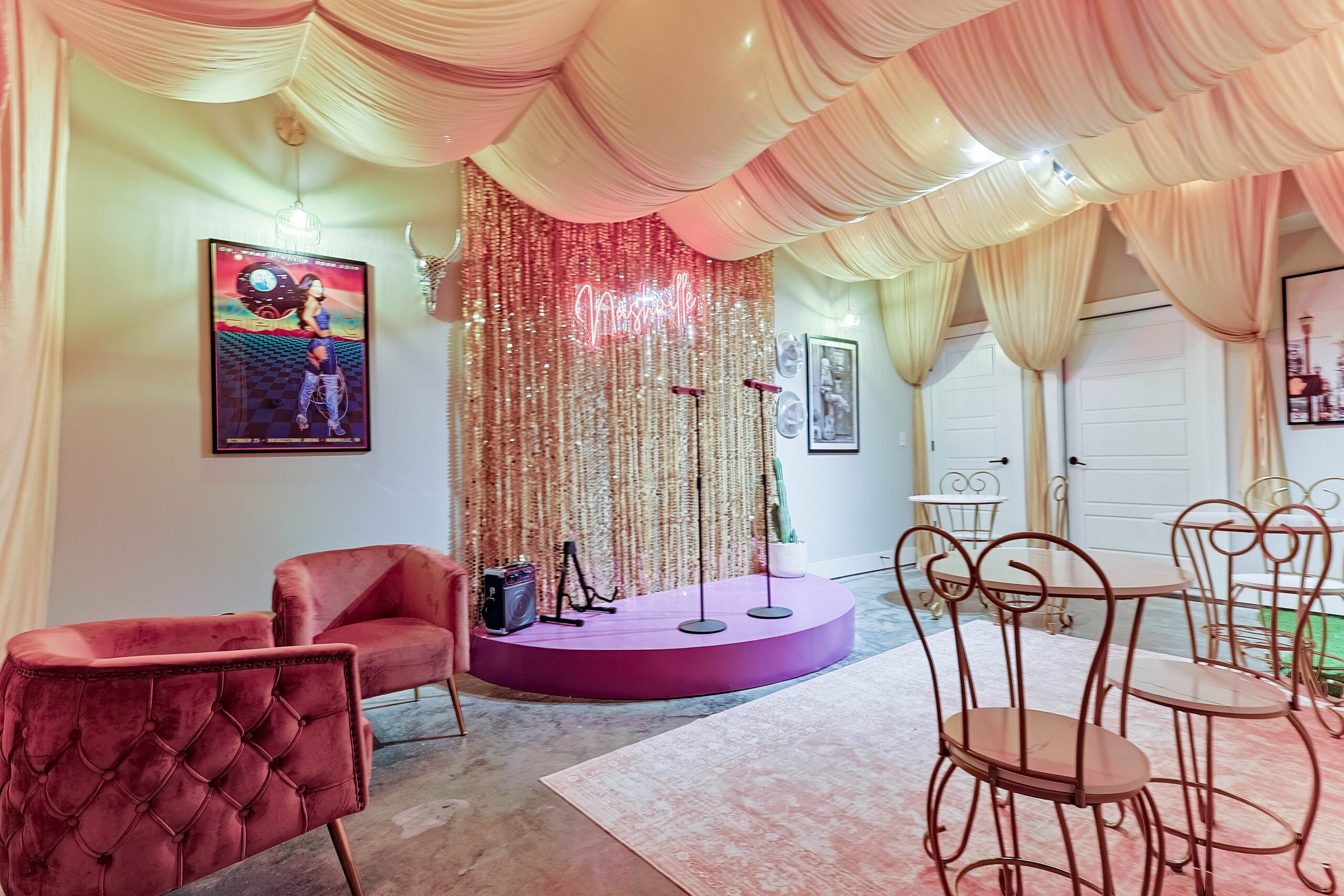 Cozy Nashville property with pink neon sign and glamorous stage setup, perfect for intimate bachelorette party vibes