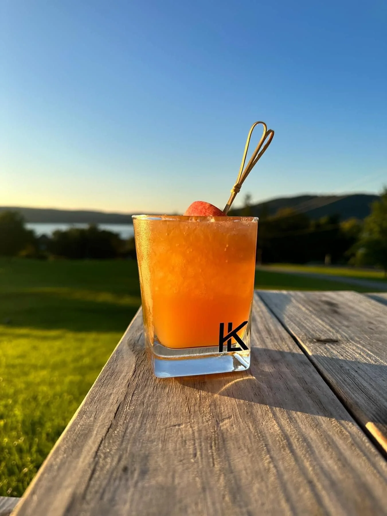 Krookid Leyk Distilling Glass with a View Outside.jpg