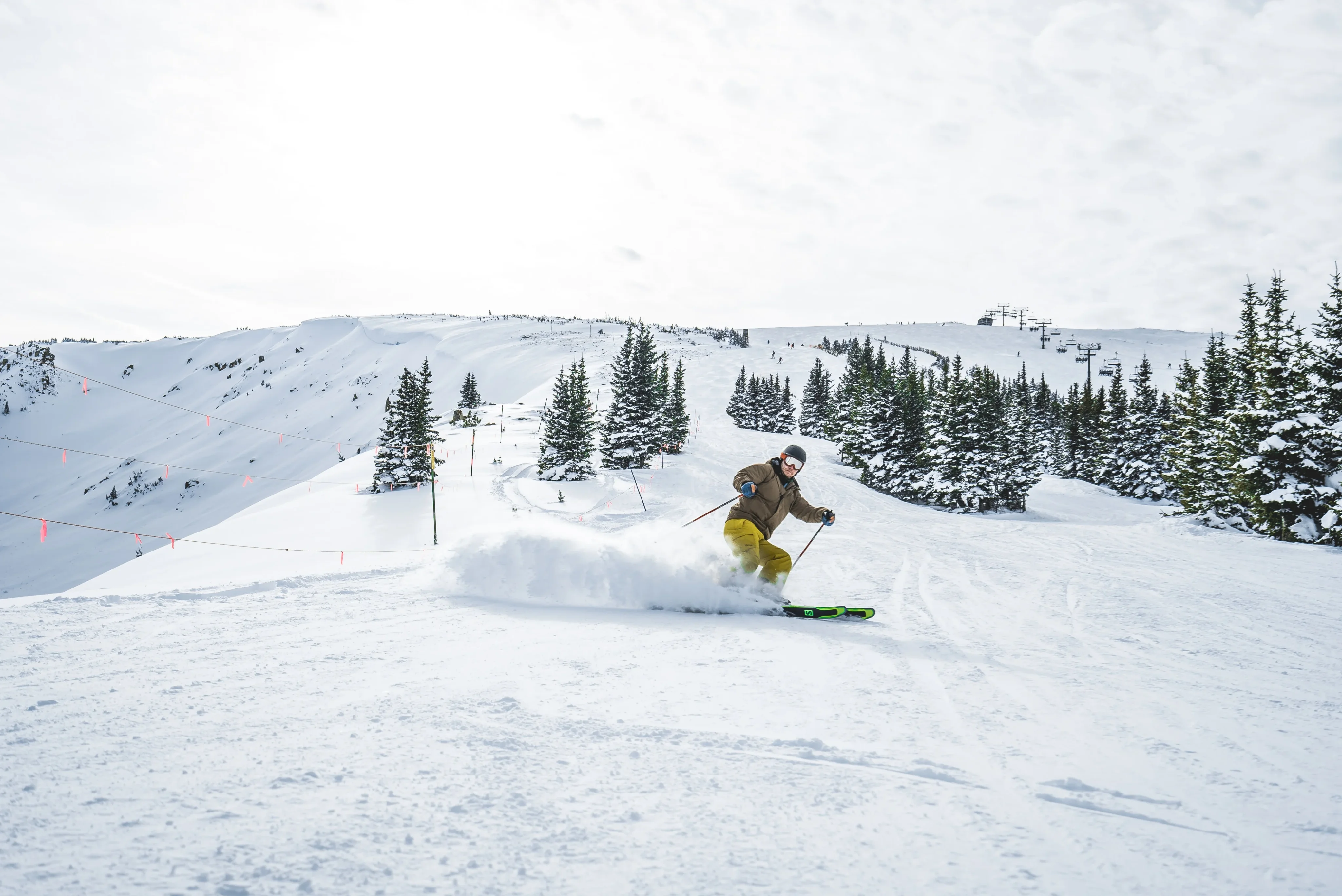Skiers on a sunny Vail run