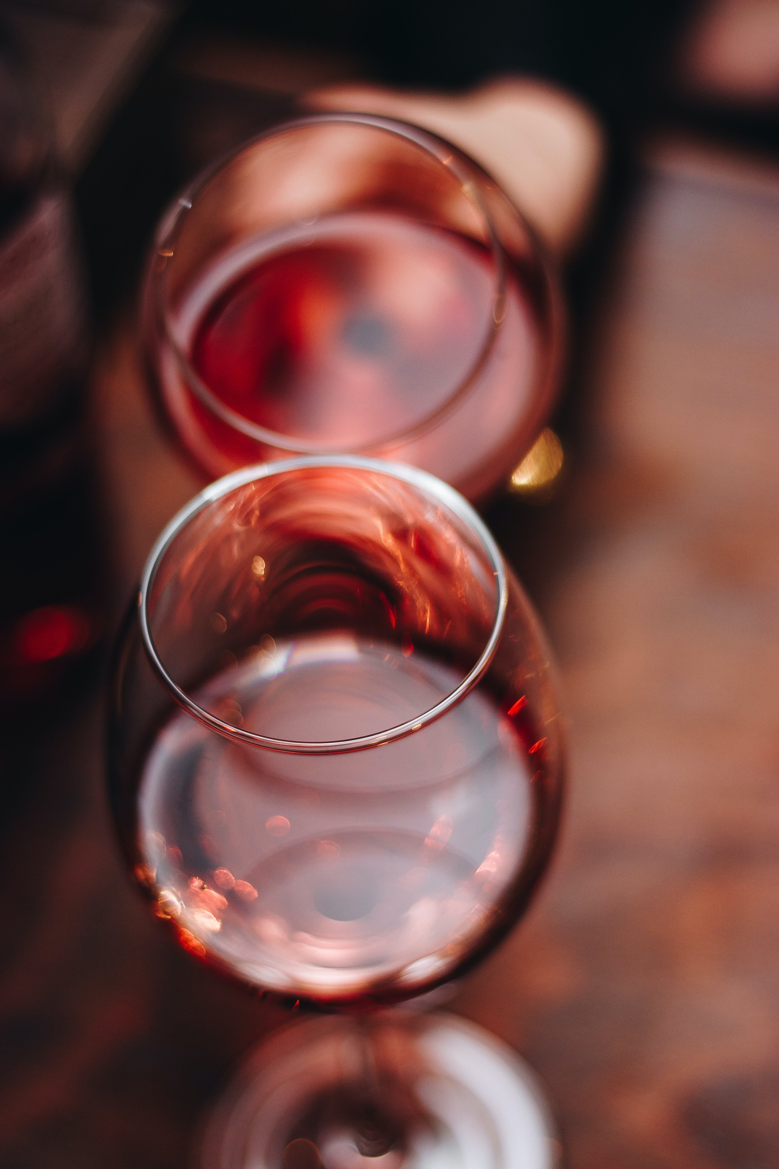 Wine glasses being raised at an outdoor event