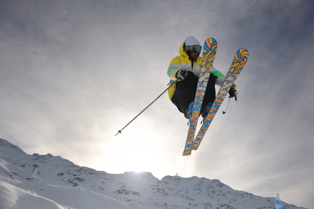 extreme freestyle ski jump with young man at mountain in snow park at winter season-2