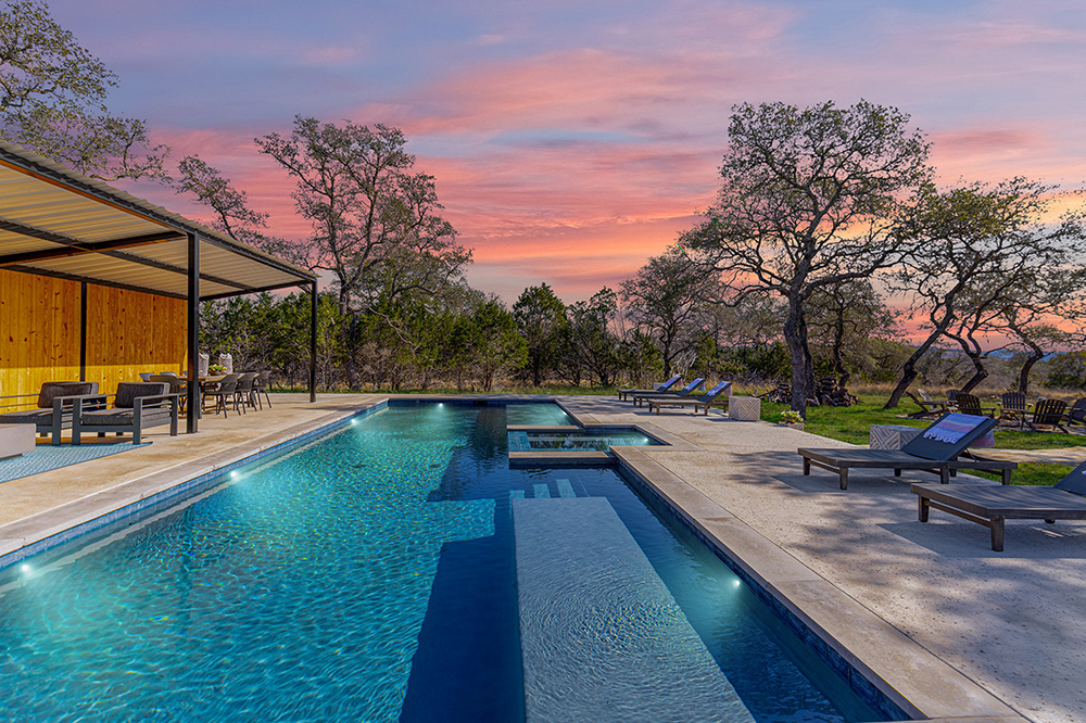 The luxury pool, hot tub, and patio at the Star Canyon Ranch in Dripping Springs, Texas.