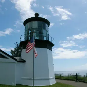 Cape Meares Lighthouse overlooking the Oregon Coast cliffs