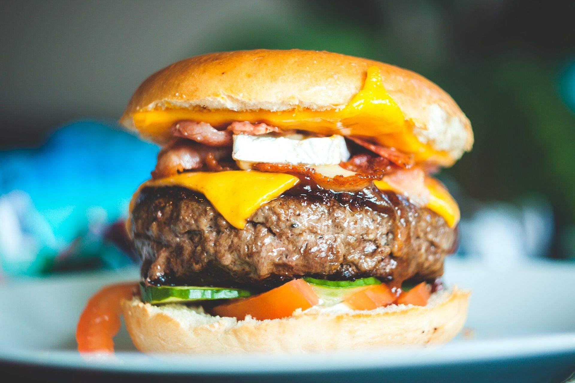 A close up of a hamburger on a plate.
