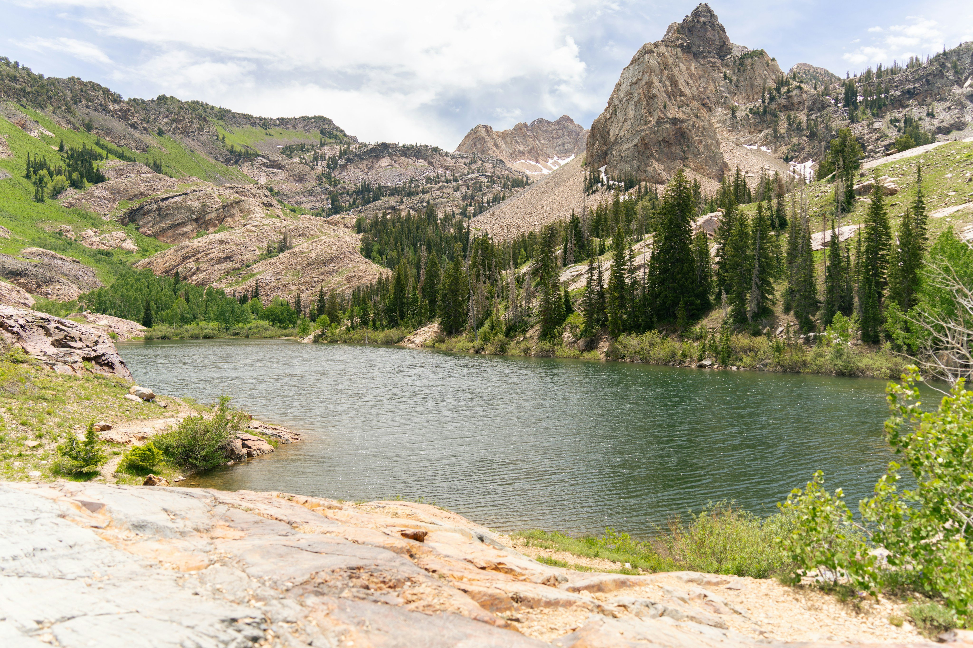 Alpine lake surrounded by rocky peaks in the Wasatch