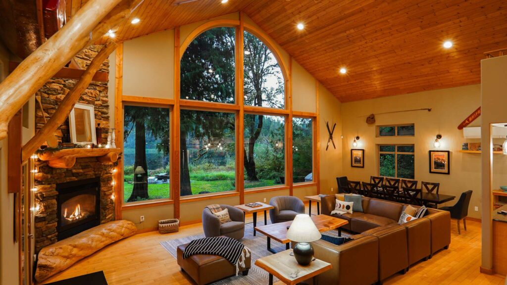 main floor of Mt. Baker cabin with peaked ceilings, large fireplace and comfortable furniture
