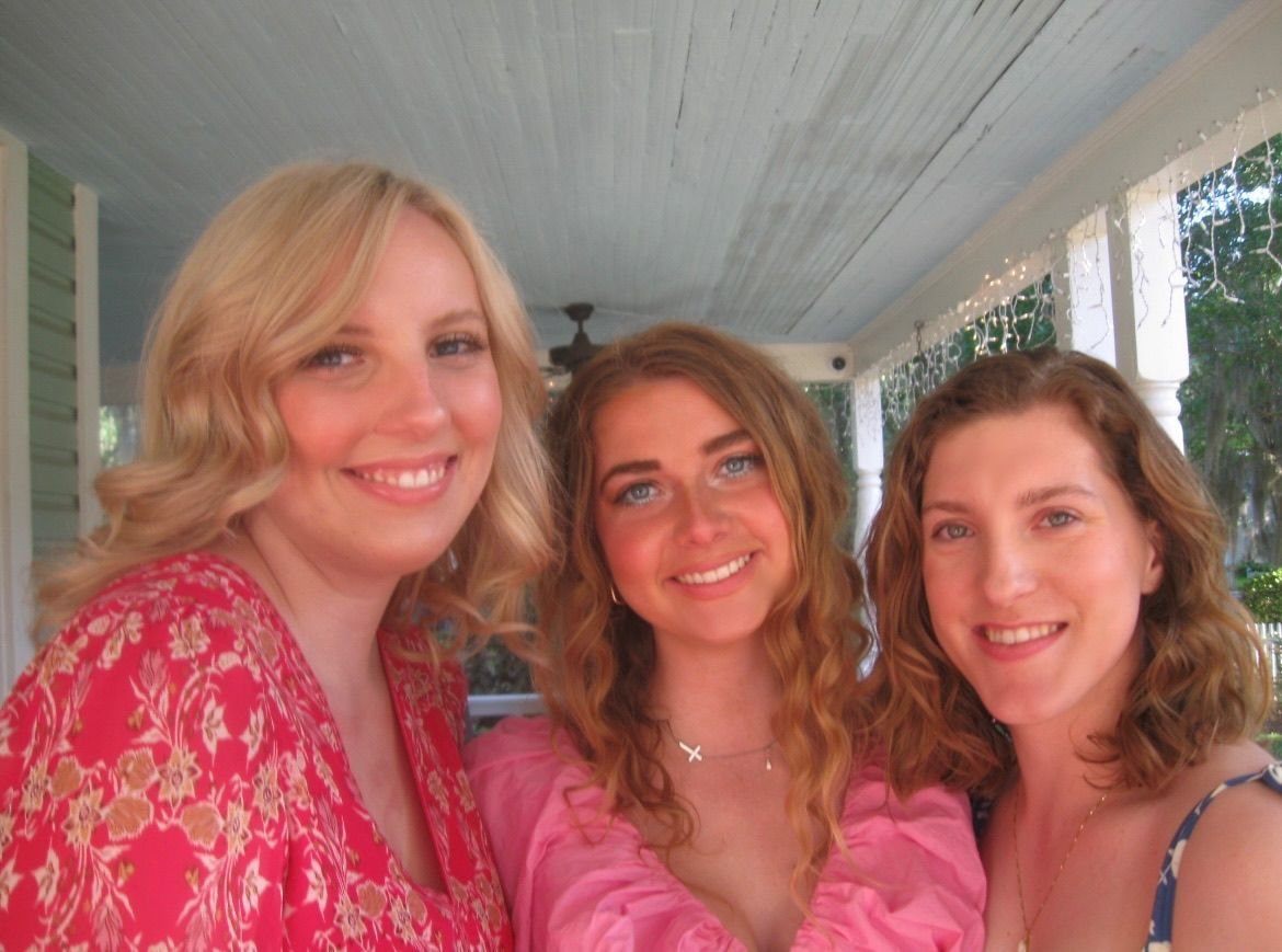 women taking selfies at the camellia rose inn
