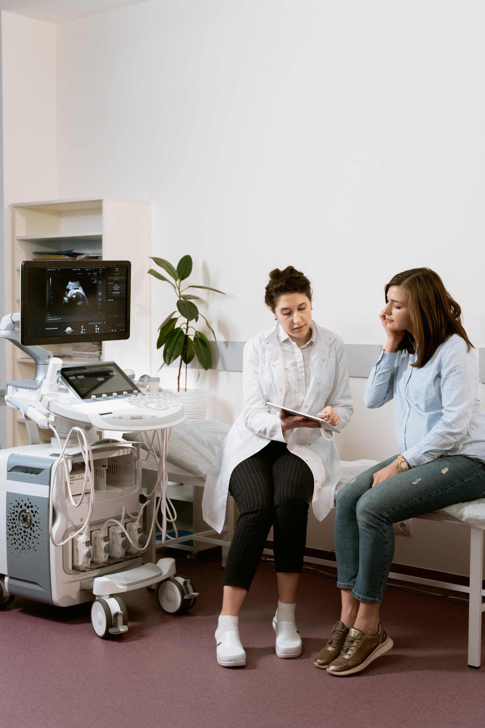 Doctor consulting with a patient in a hospital room