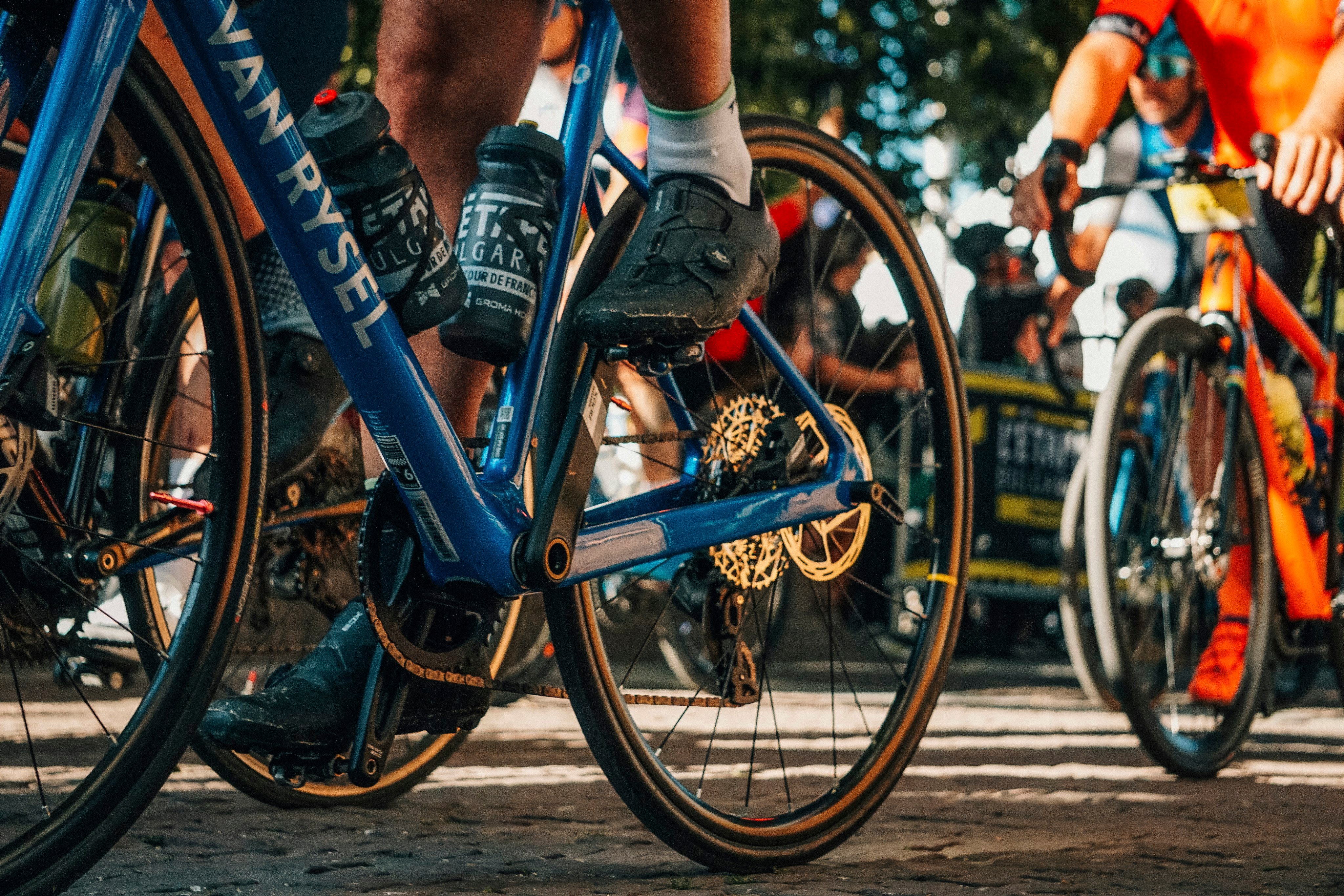 Gravel bike wheels and drivetrain at the race start line