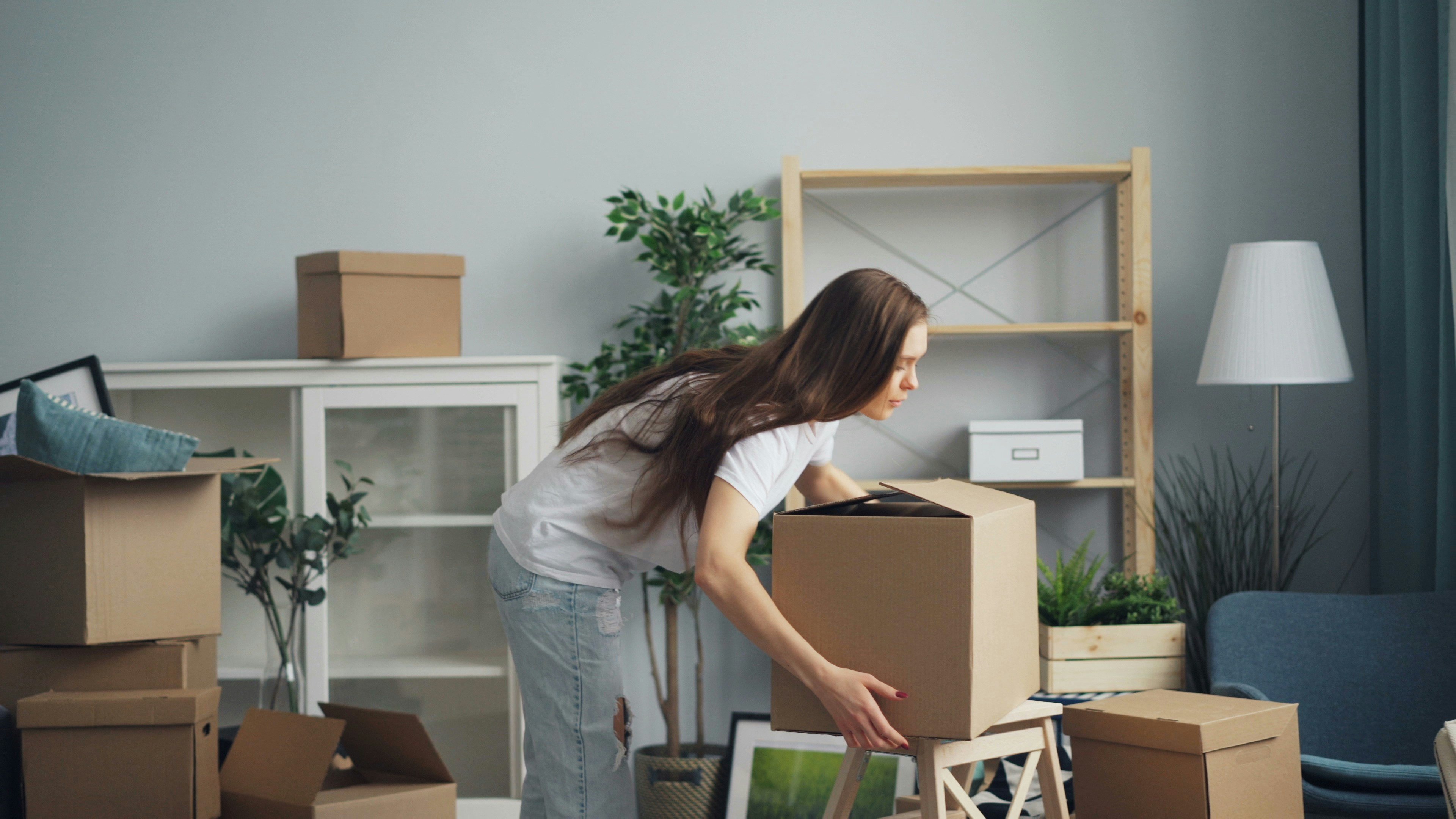 Woman unpacking boxes in a new home