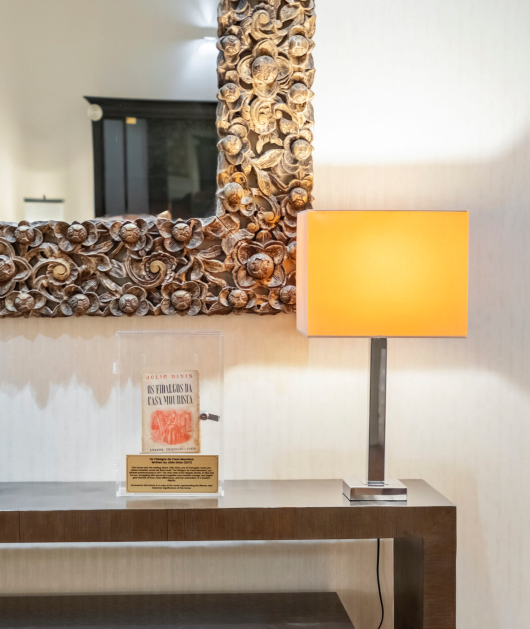 Rare edition of Os Fidalgos da Casa Mourisca by Júlio Dinis displayed on a wooden console table at Villa Diniz, Funchal.