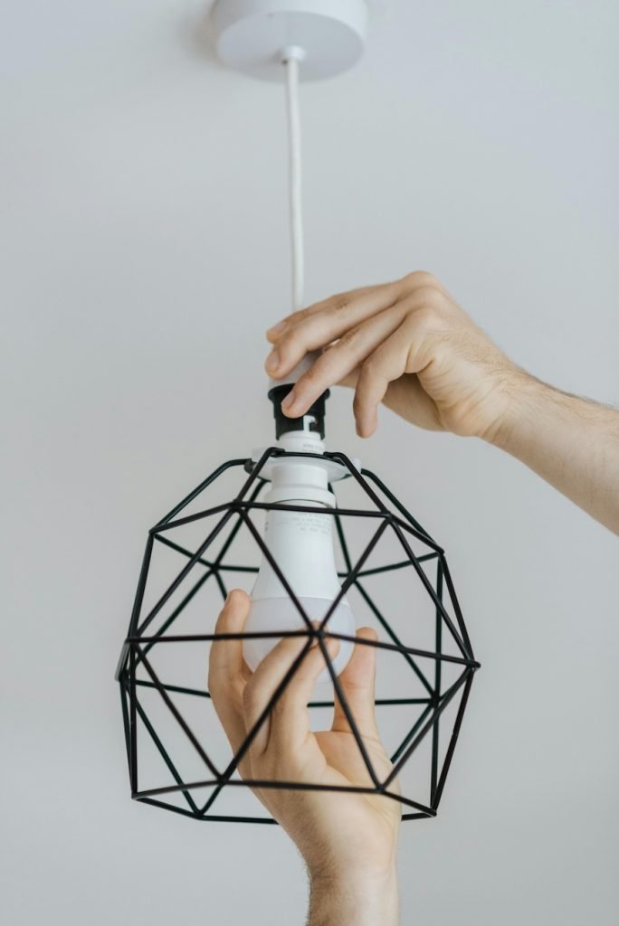 changing a lightbulb preventative maintenance for Las Vegas Condo
