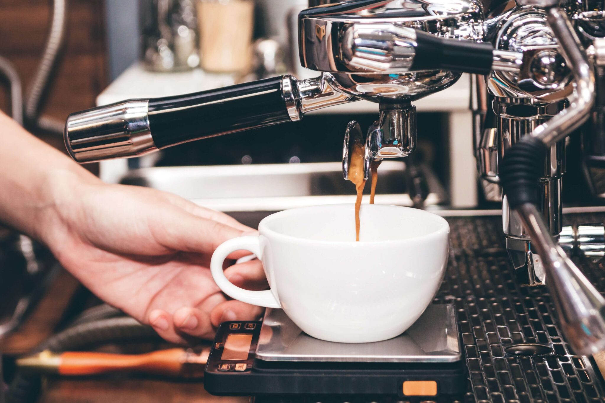 A person making a New Mexico Coffee.