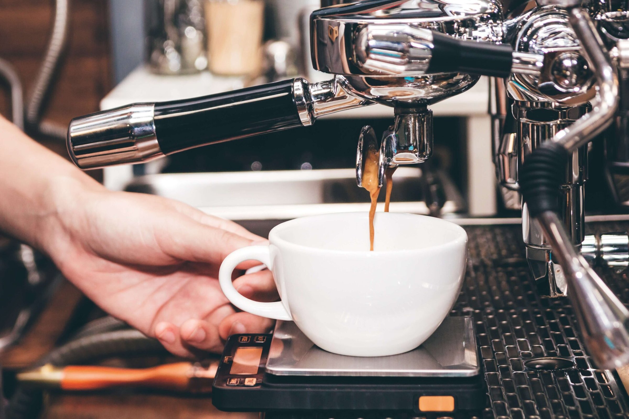 A person making a New Mexico Coffee.