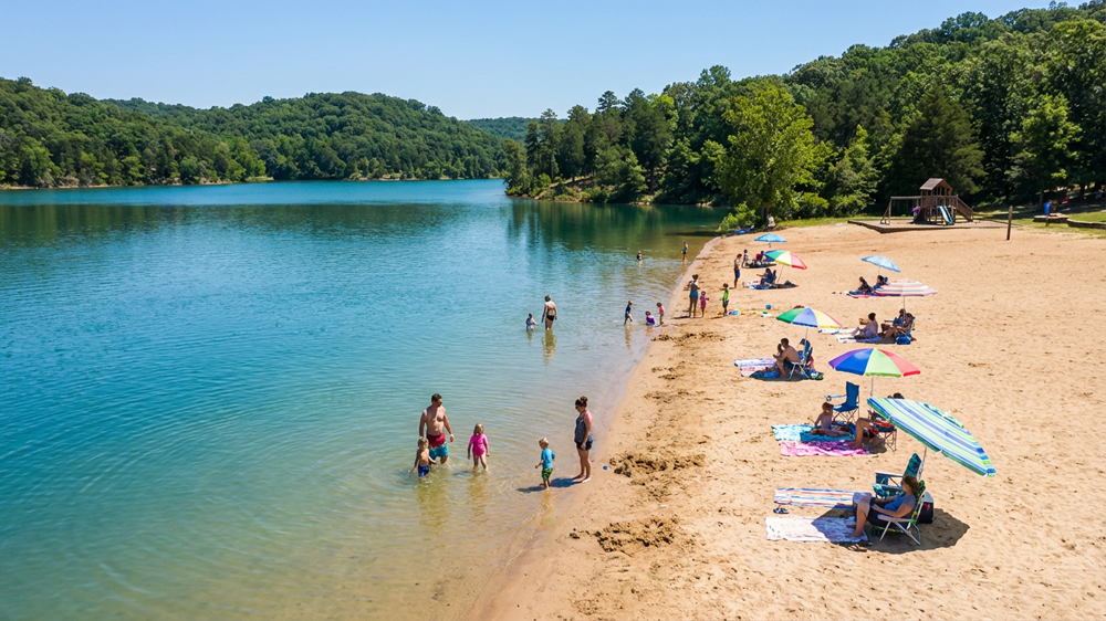 Family enjoying a pontoon boat ride on Table Rock Lake with clear blue water and Ozark shoreline in the background