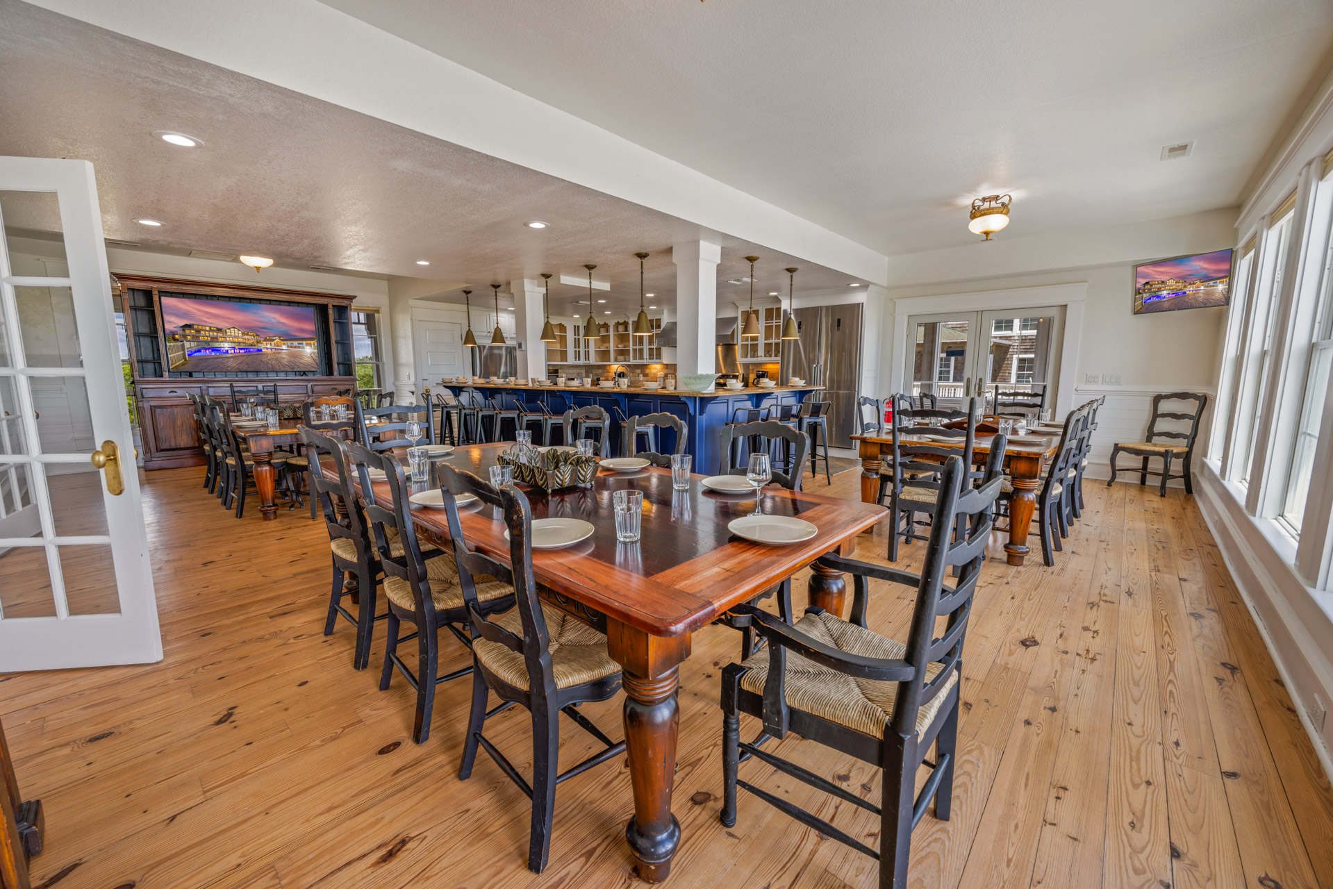 Spacious open-plan dining and kitchen area at a LuxStay USA estate, designed for large groups