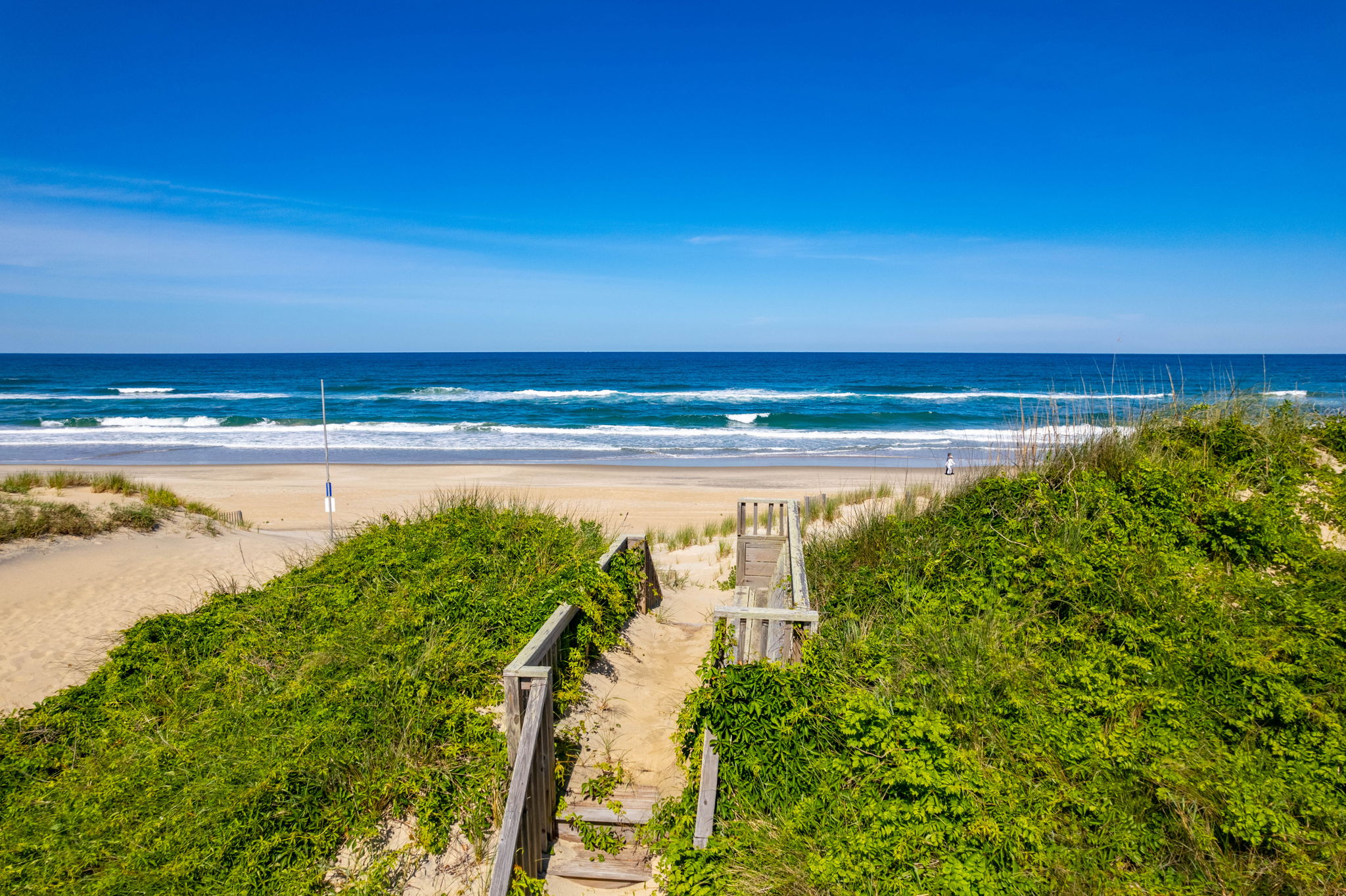 Private dune walkover leading to the beach at a LuxStay USA Corolla estate