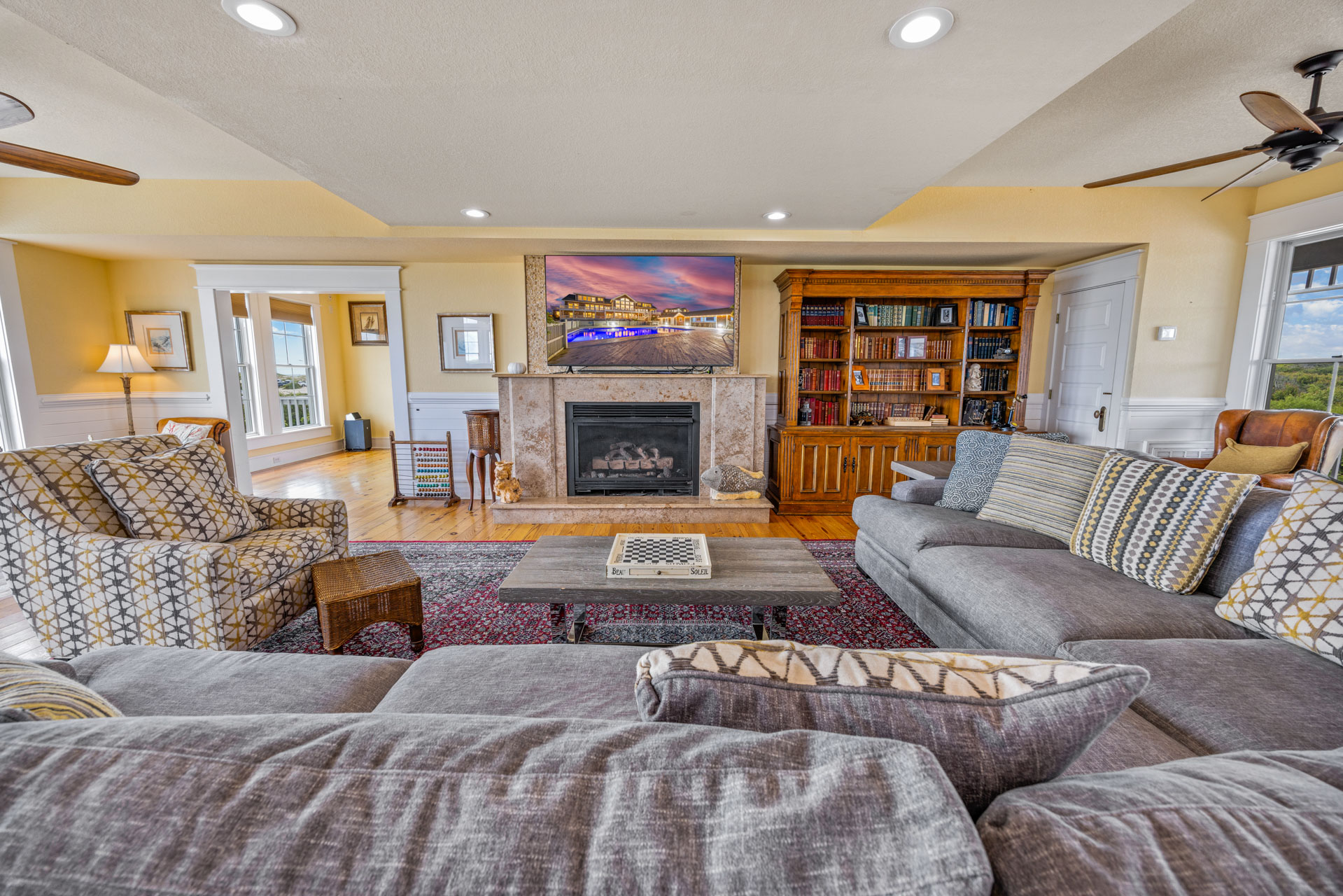 Spacious luxury living room with marble fireplace at a Snowshoe ski condo