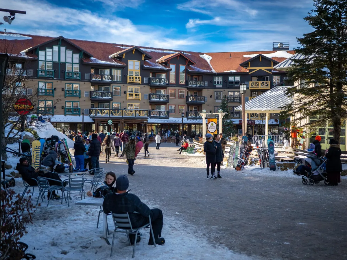 Luxury ski-in ski-out condo at Snowshoe Mountain Village Central near Ballhooter Lift with snowy slopes and mountain views