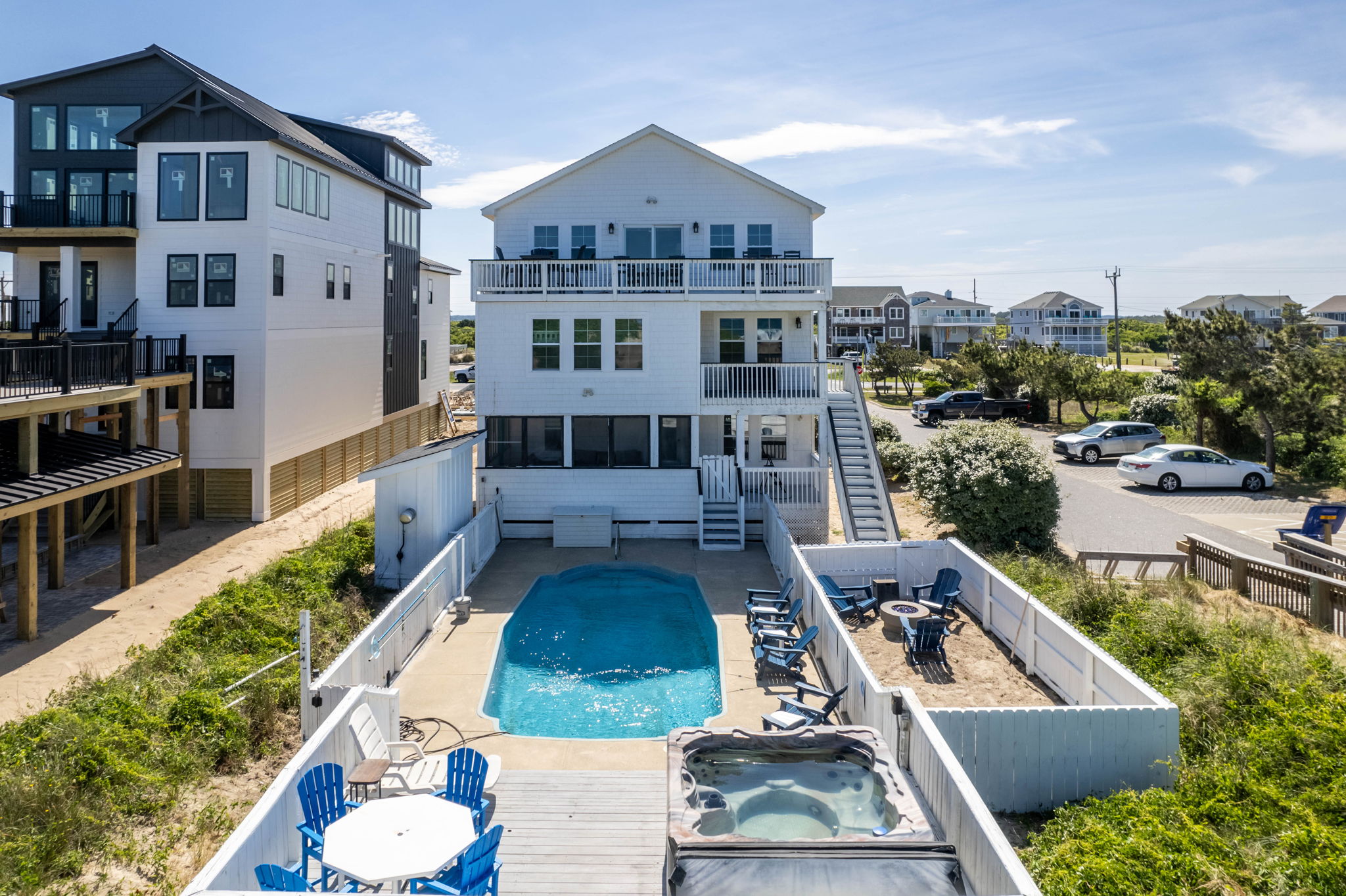 Three-story oceanfront luxury rental in the Corolla 4x4 area with private pool and multiple decks