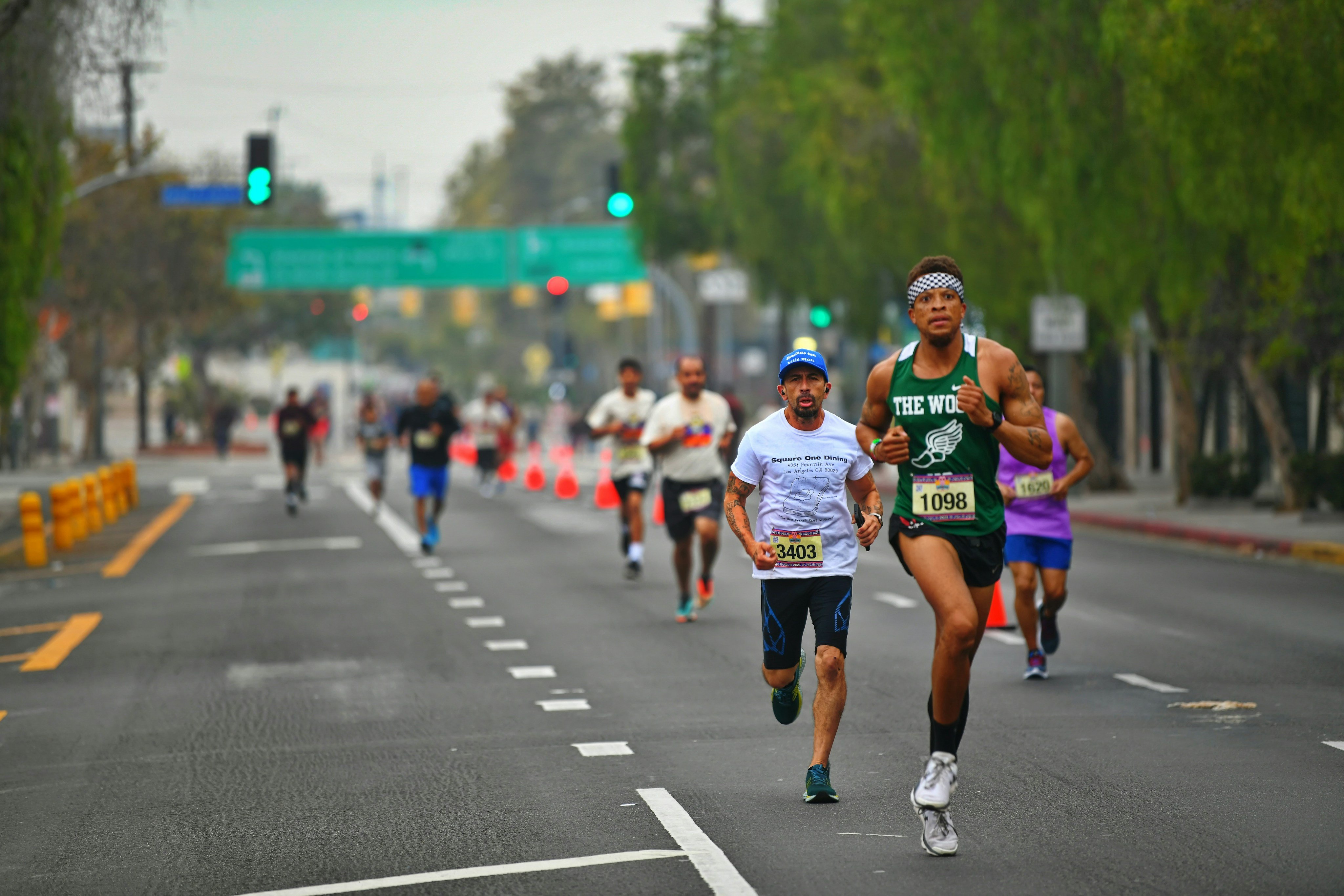 Runners on a closed Los Angeles street during a spring marathon