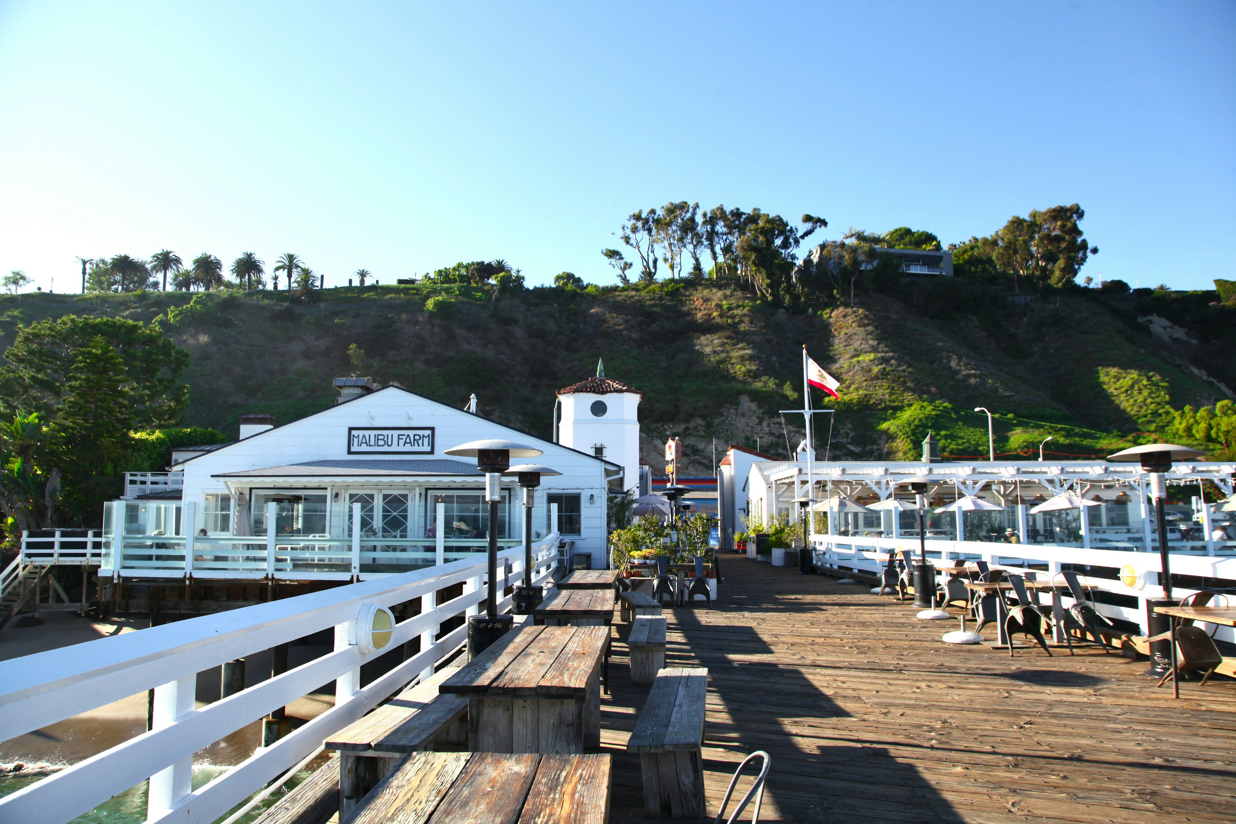 Malibu pier restaurant with outdoor seating and ocean views