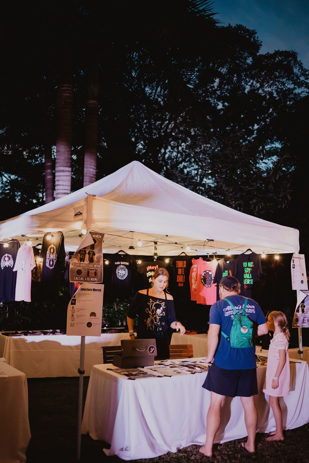 Band merch tent at Domingo Gigante de Rock, Los Gatos Negros and The Conductors merchandise