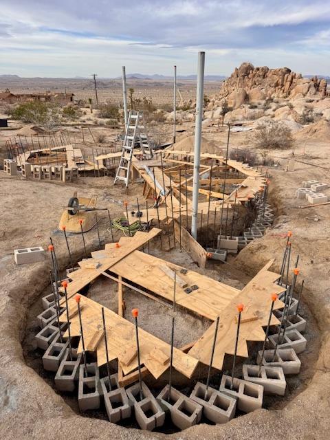 Cinder block and plywood templates forming the curved walls