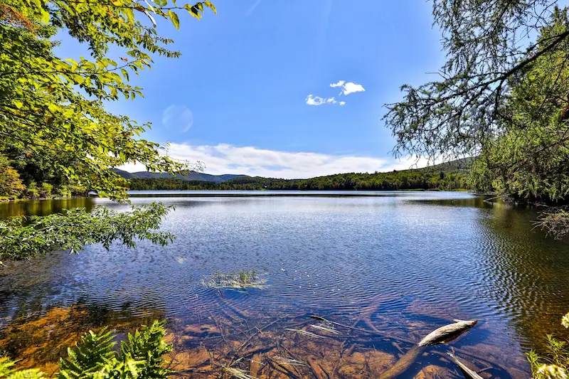 View of Kent Pond in Vermont on a sunny summer day.